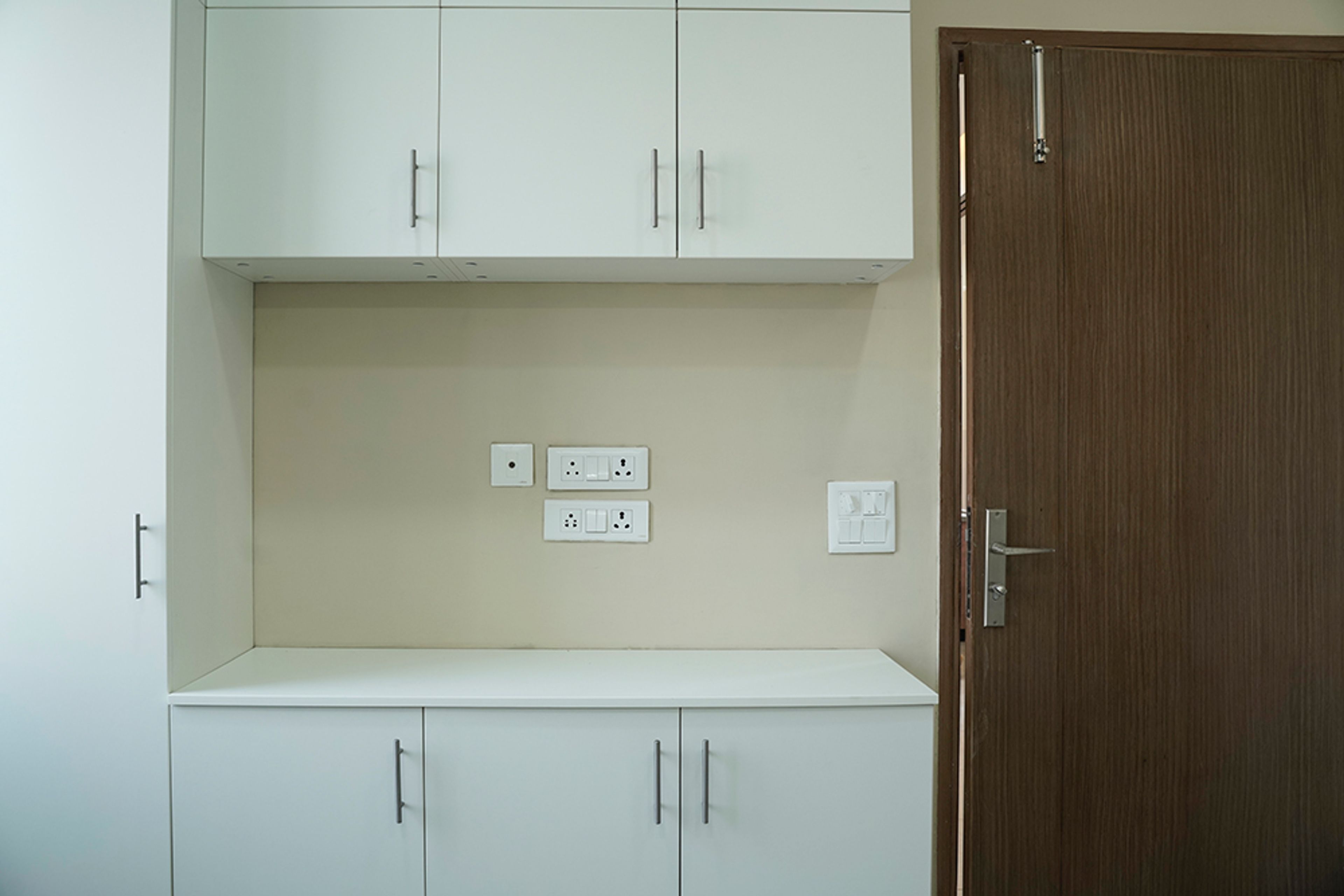 Contemporary Crockery Unit Design with White Units in Noida 3BHK Apartment
