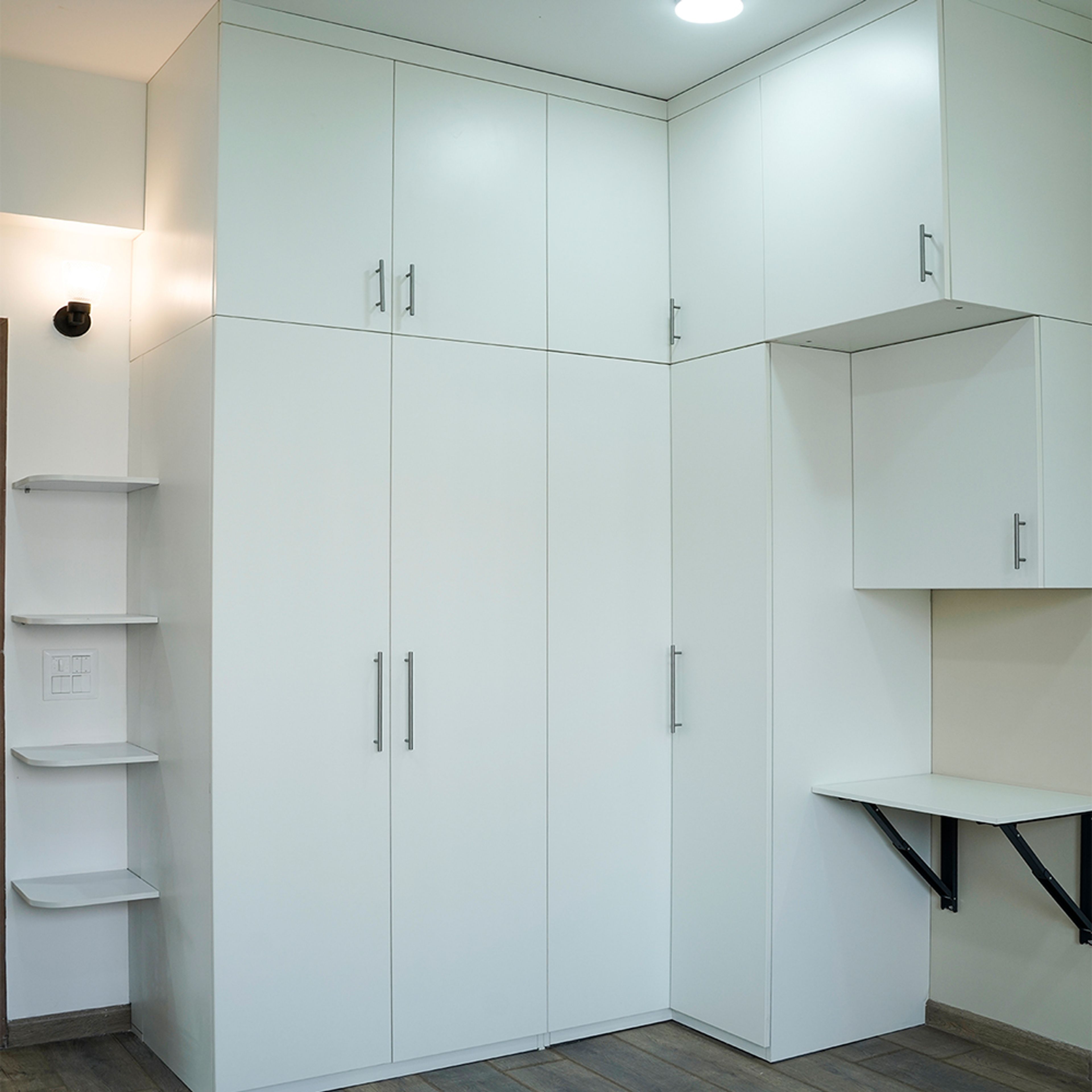 Contemporary Swing Wardrobe Design with Attached Study Unit in Noida 3BHK Apartment