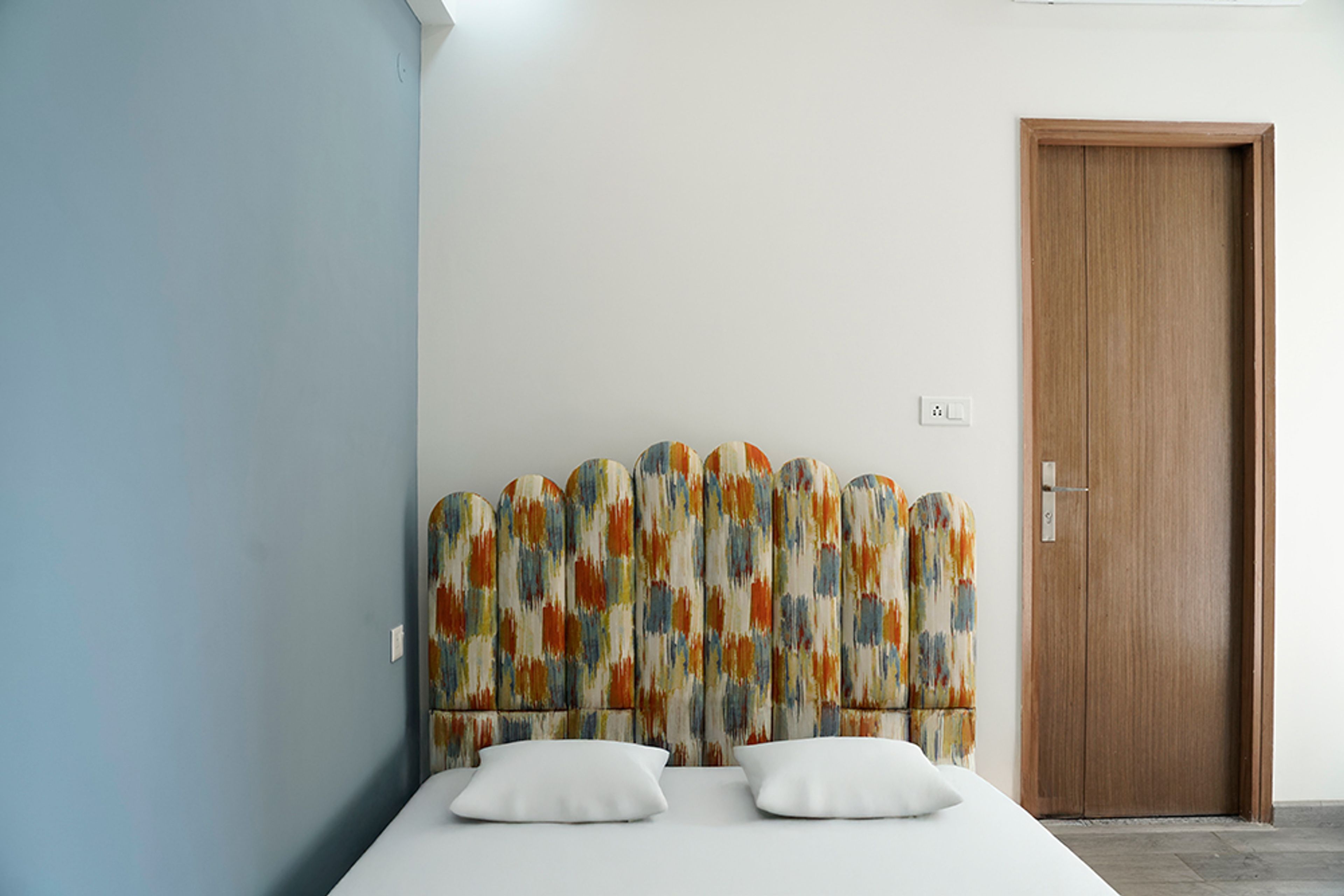 Contemporary Bedroom Design with Blue Wall in Noida 3BHK Apartment