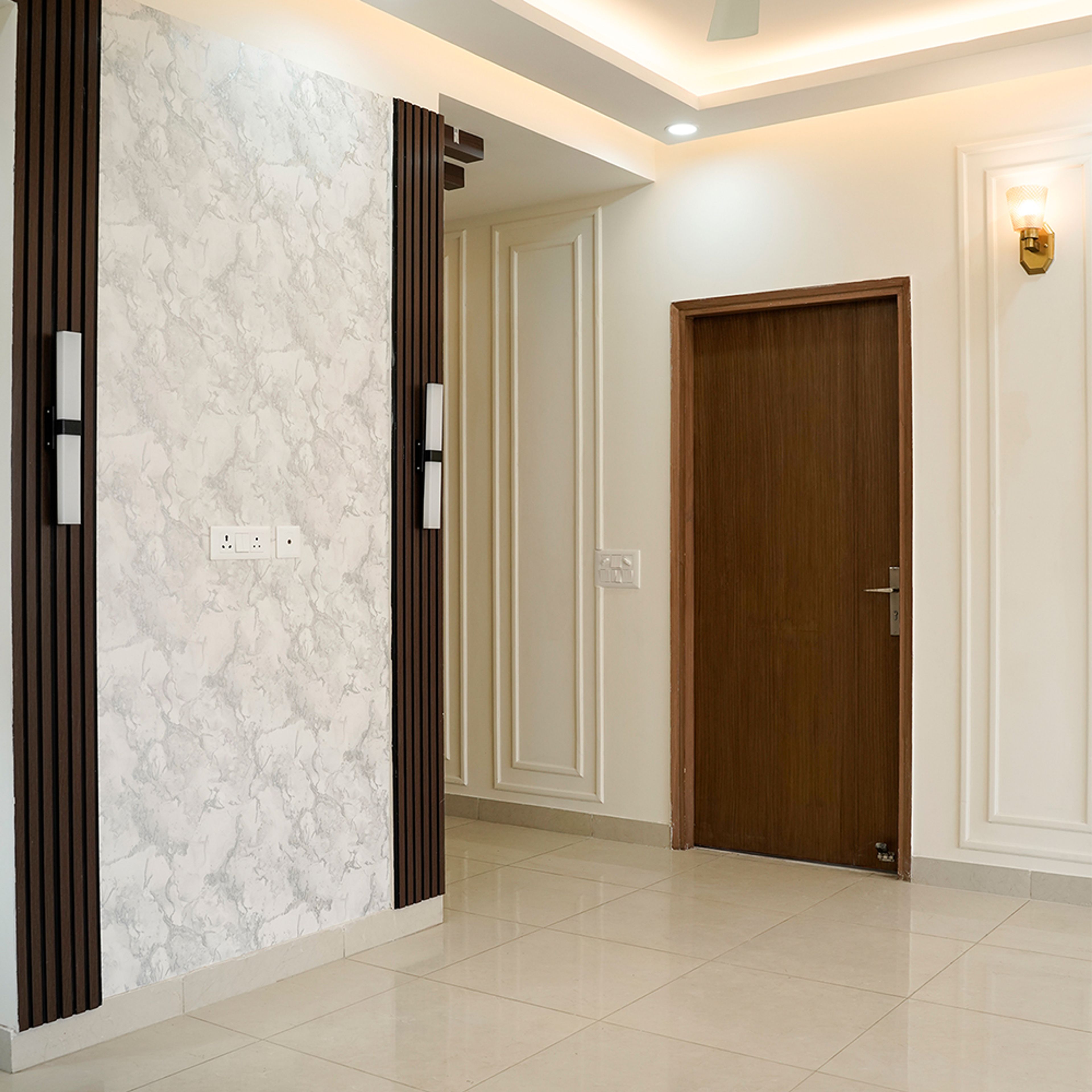 Contemporary Living Room Design with White Marbel Textured Wall in Noida 3BHK Apartment