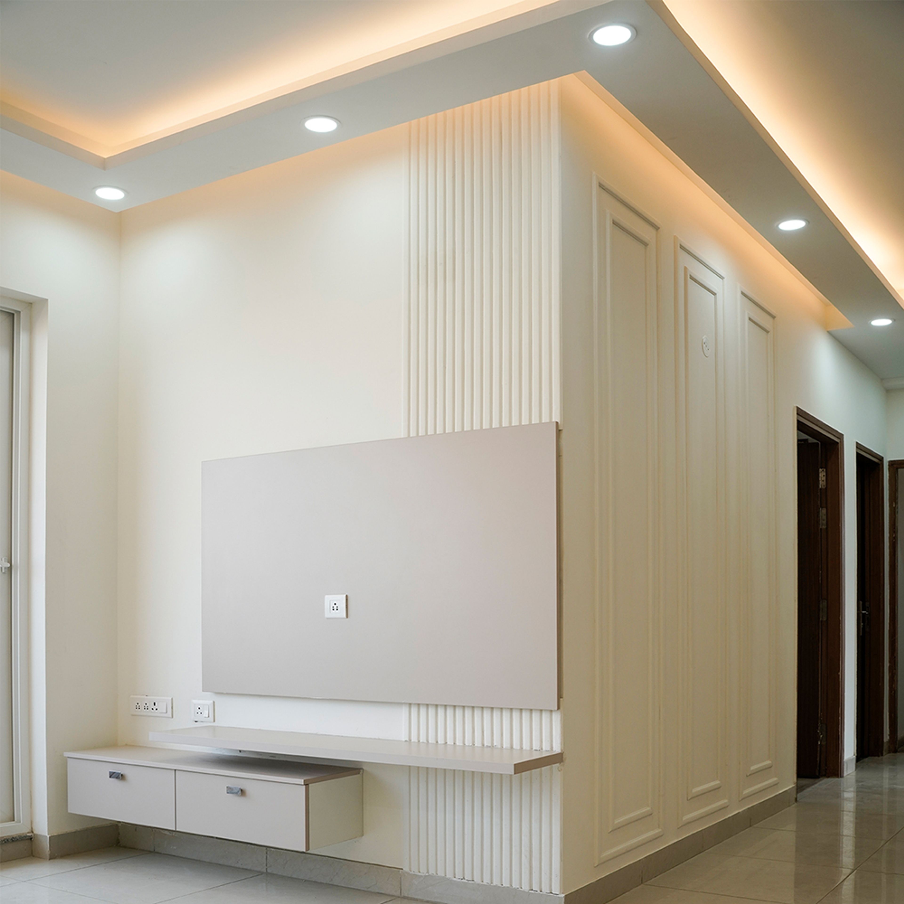 Contemporary TV Unit Design with Cream Wall in Noida 3BHK Apartment