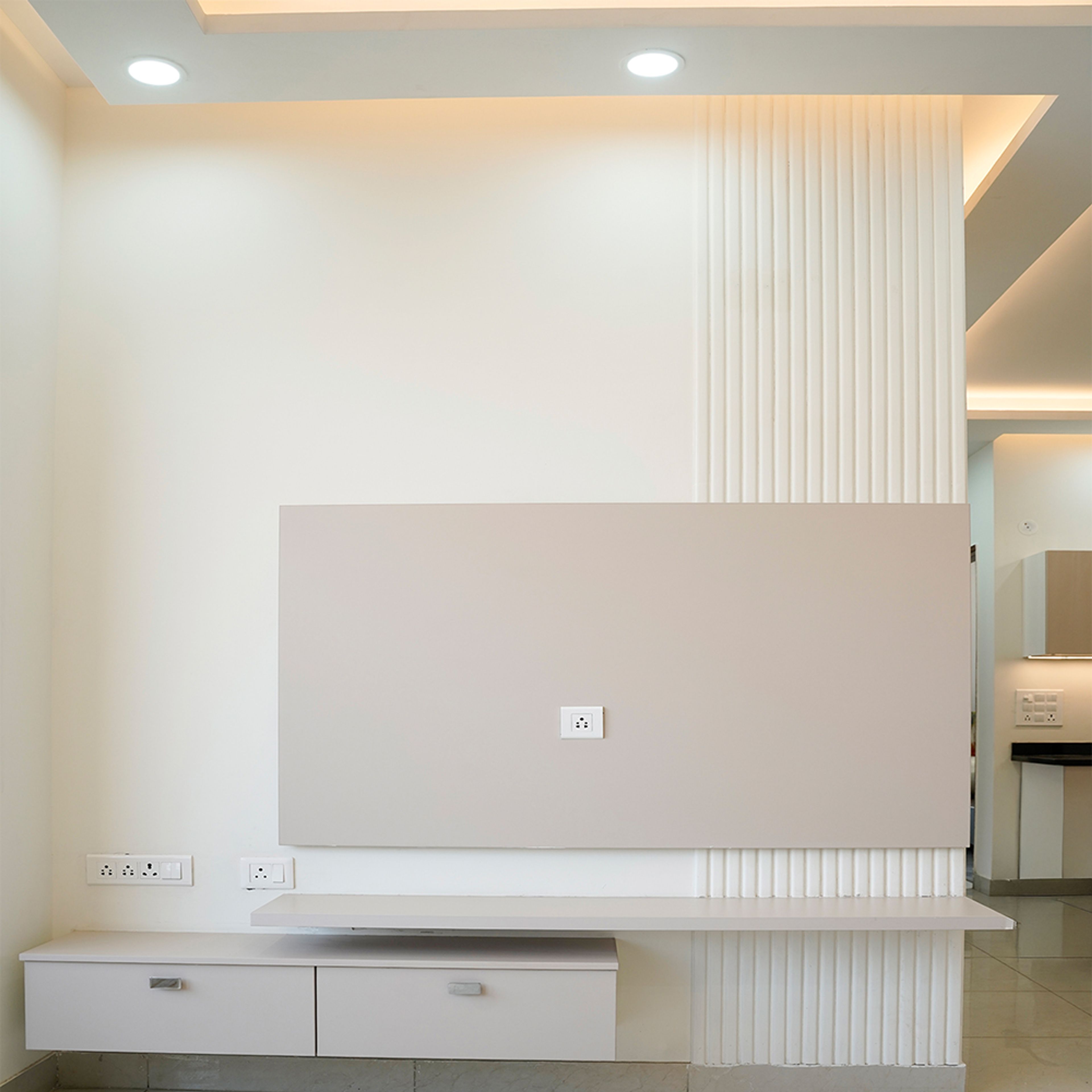Contemporary TV Unit Design with Cream Wall in Noida 3BHK Apartment