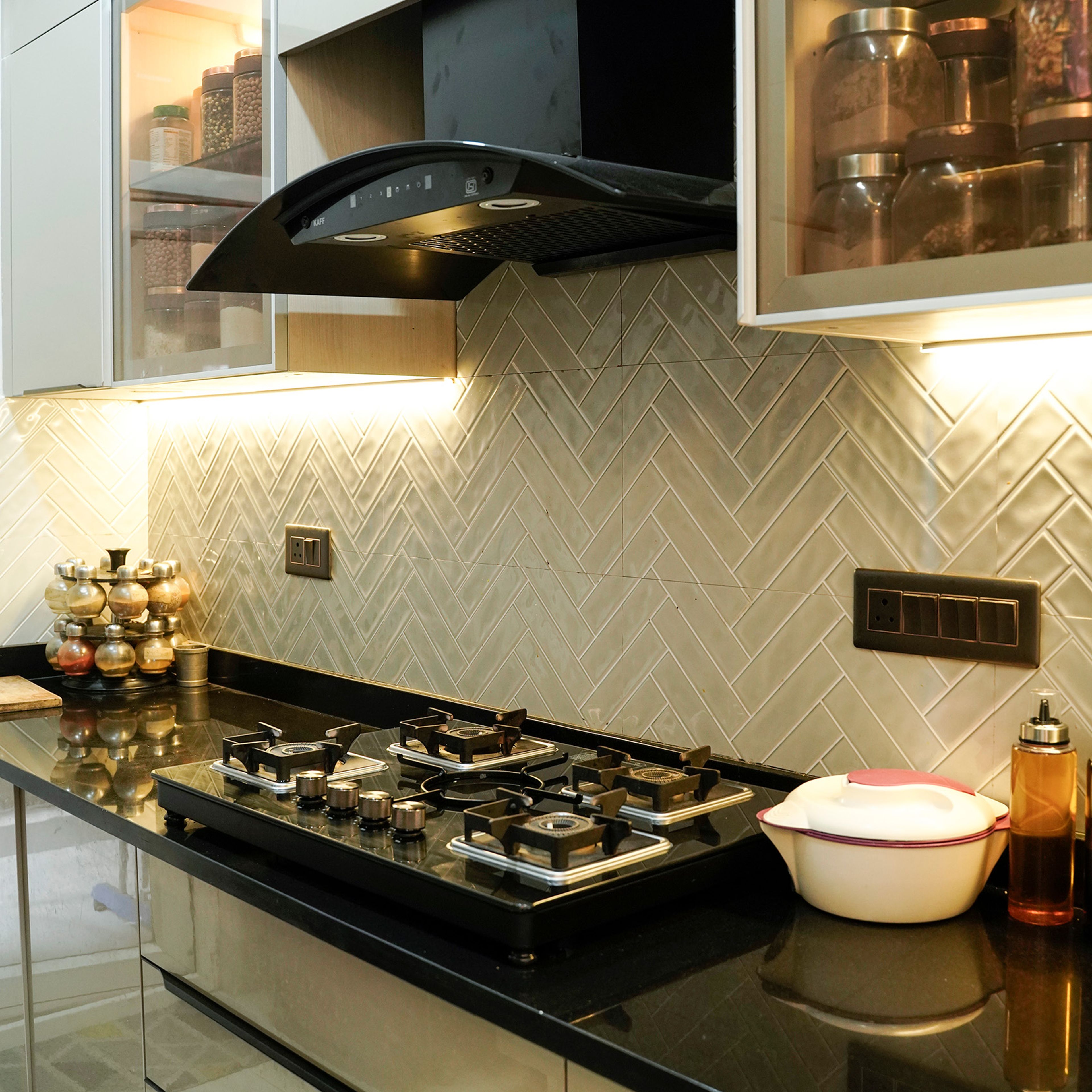 Parallel Kitchen Design with Under Cabinet Lighting and Geometric Beige Tiles