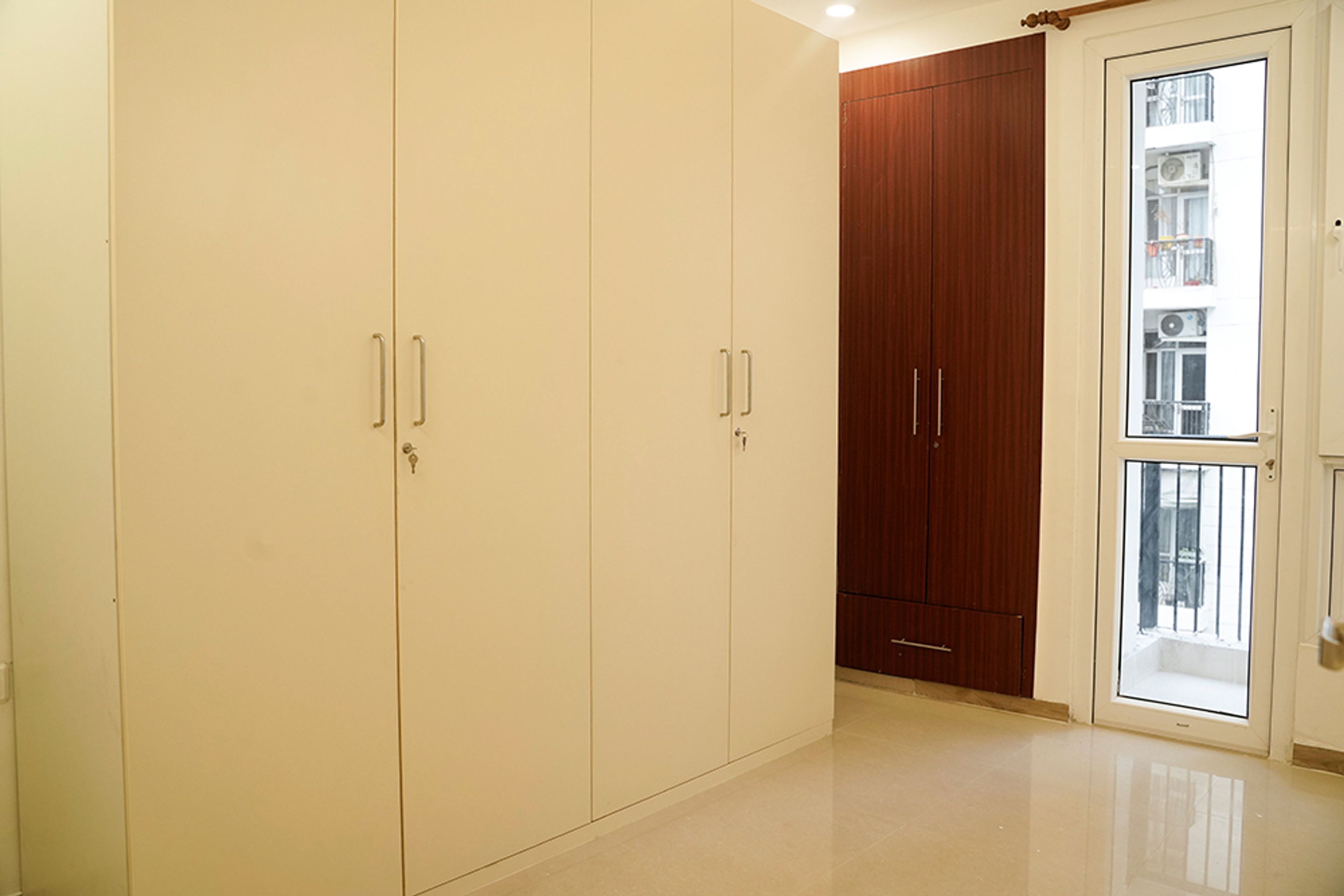 Bedroom Design with 4-Door Cream Swing Wardrobe