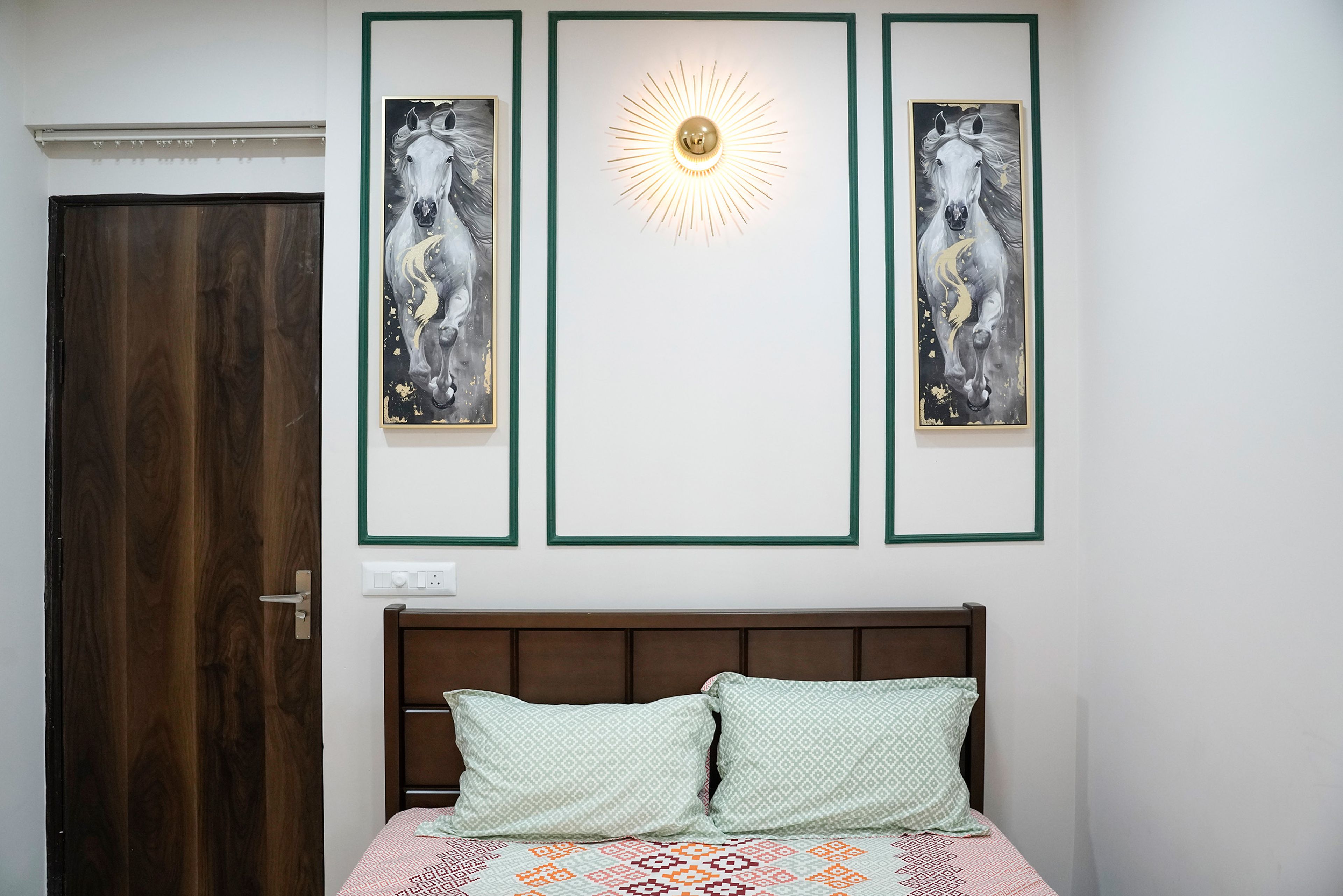 Bedroom design with wooden headboard bed and white wall with green trims