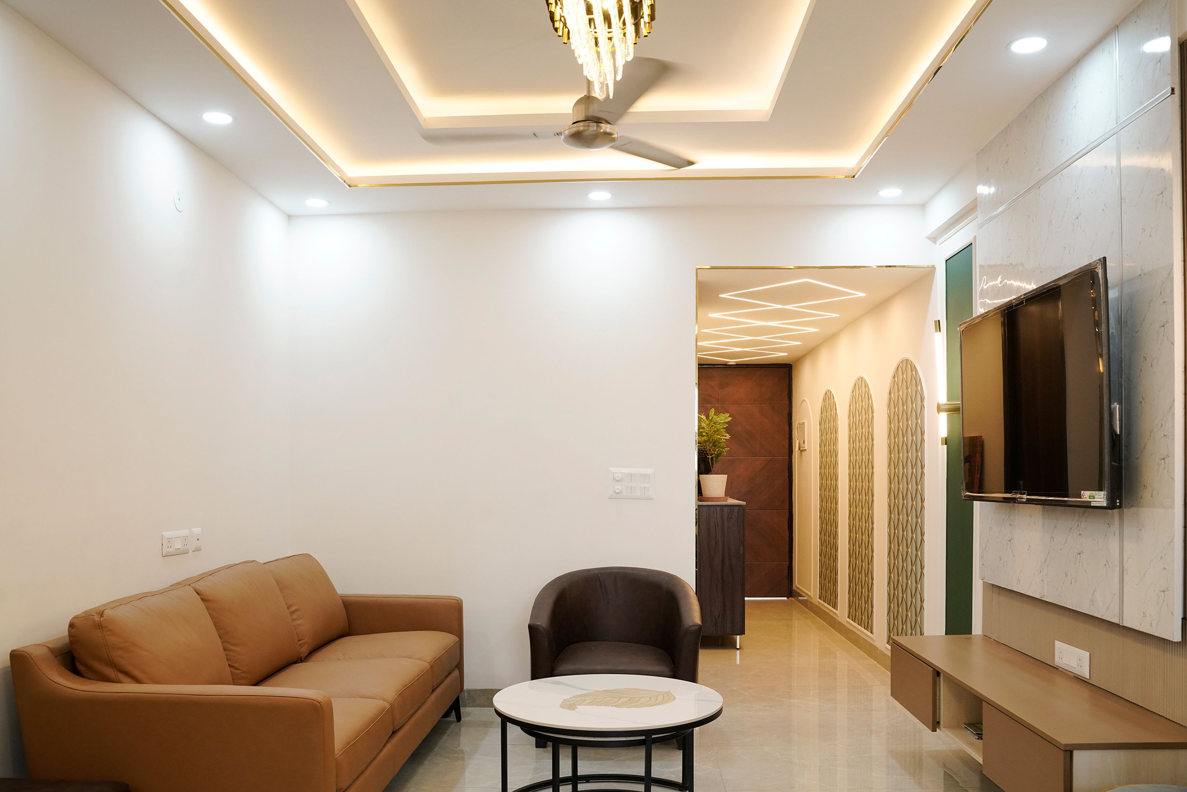 Living-cum-dining room with brown sofa