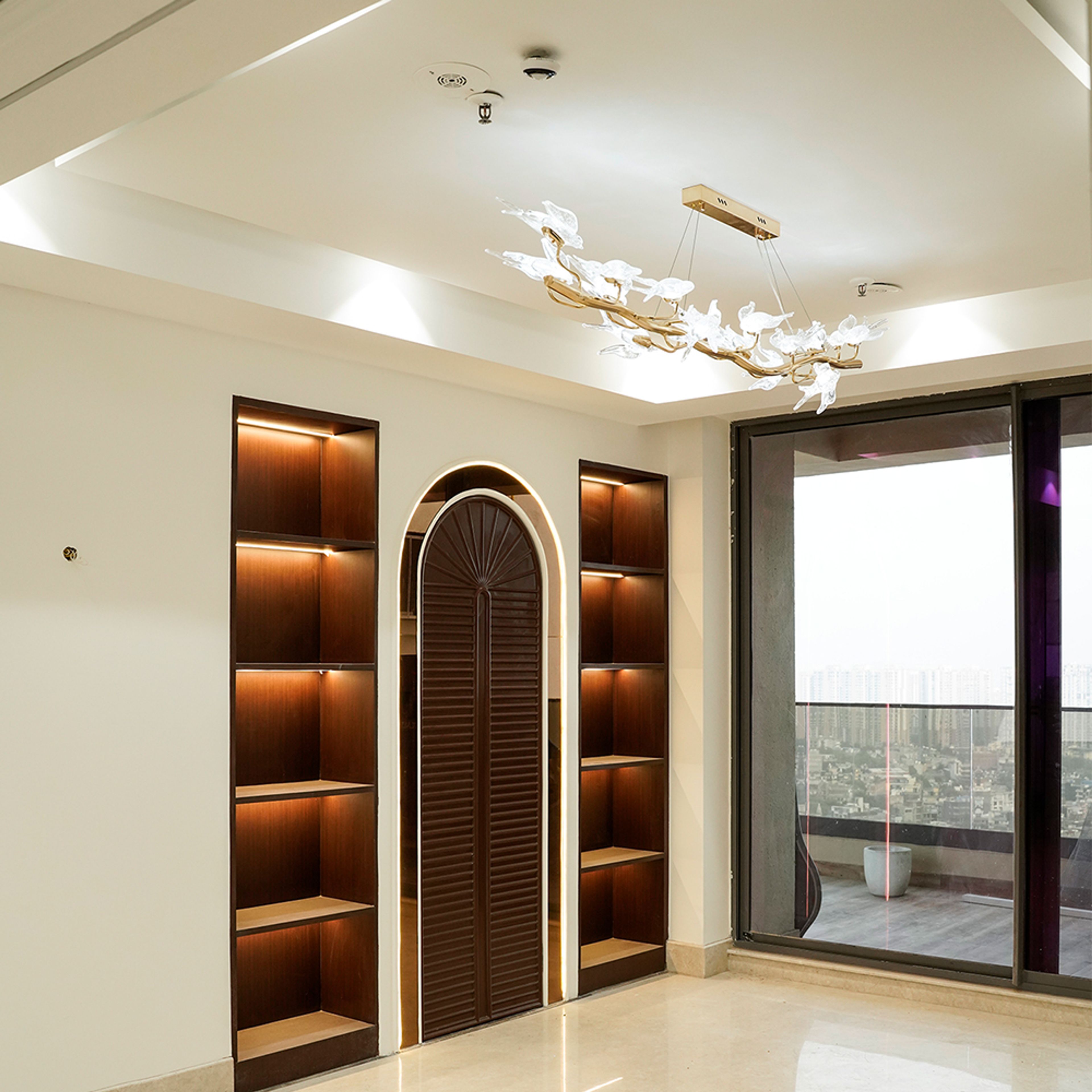 Living Room Design with Crockery Unit with Strip Lights Underlighting and Abstract Chandelier