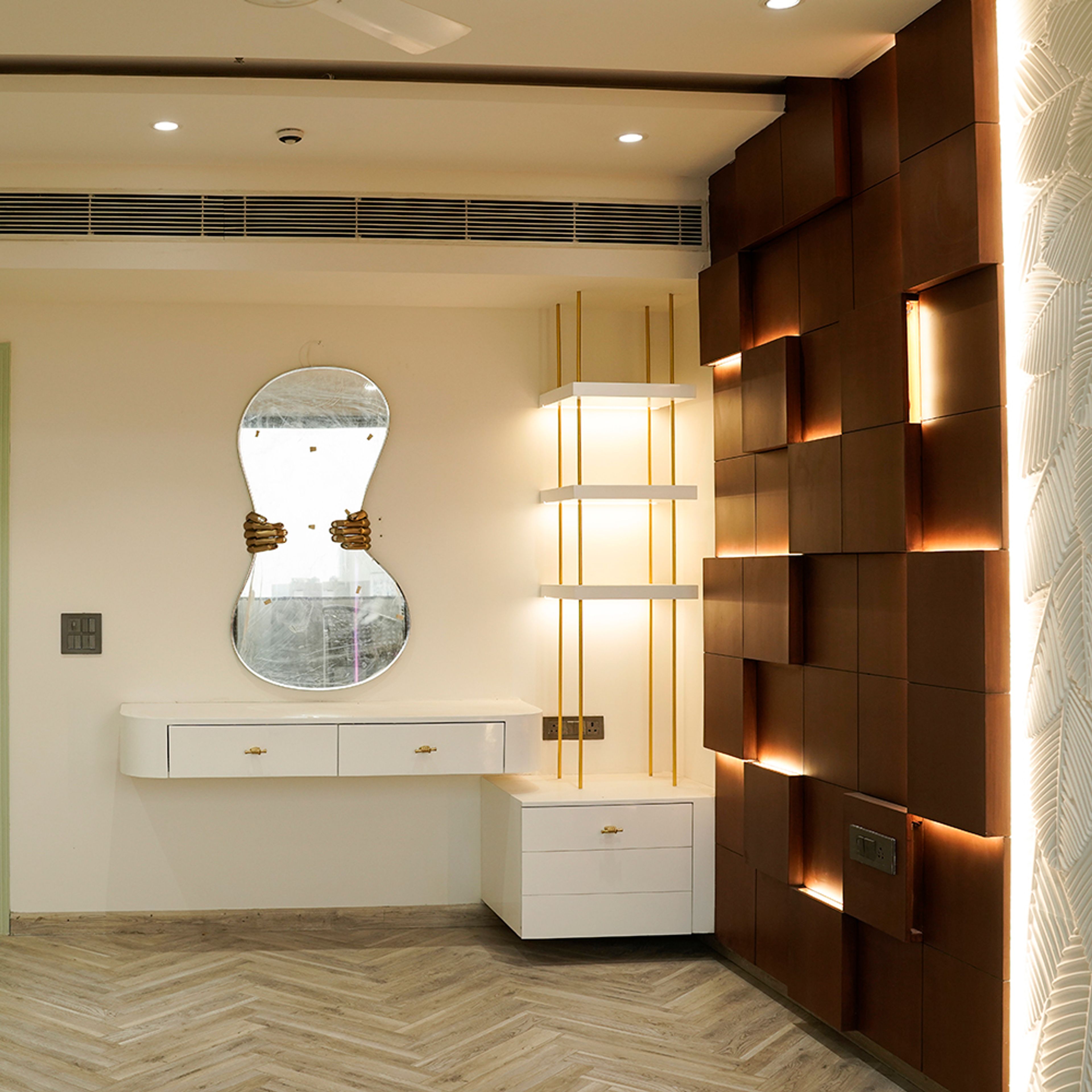 Living Room Design with Abstract Shaped Mirror with Off-White Drawers