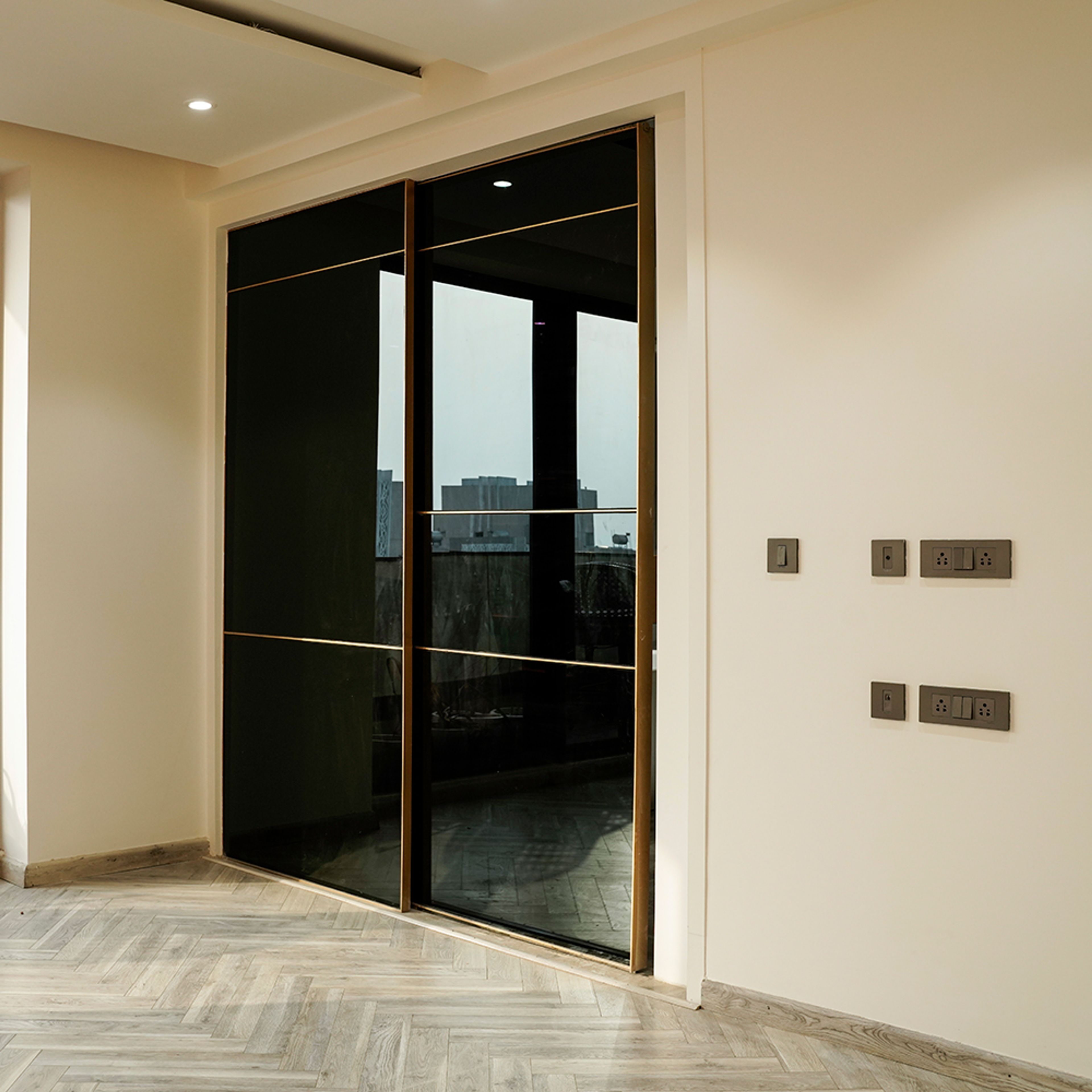 2-Door Black Tinted Glass Sliding Wardrobe Design