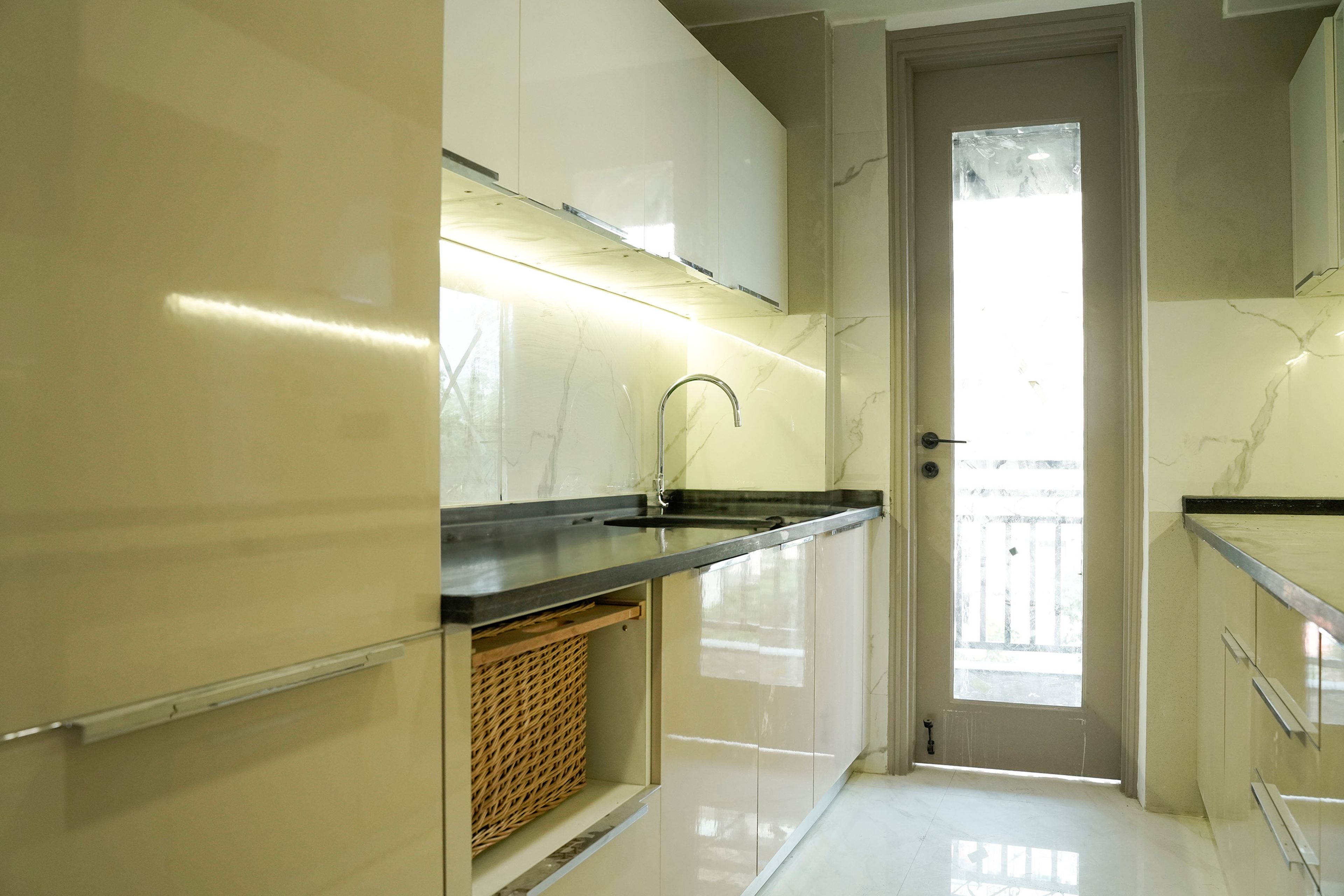 Parallel Kitchen Design with Cream Base Unit and Under Cabinet Lighting