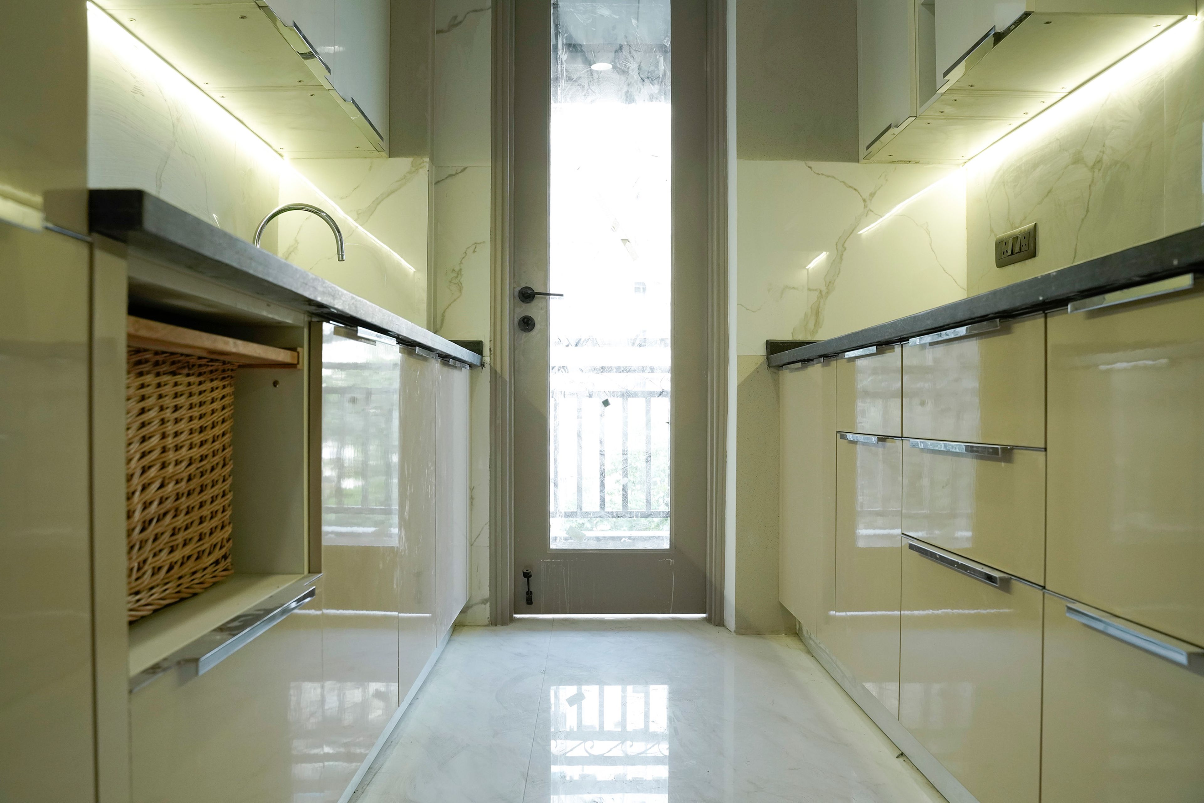 Parallel Kitchen Design with Cream Base Unit and Under Cabinet Lighting