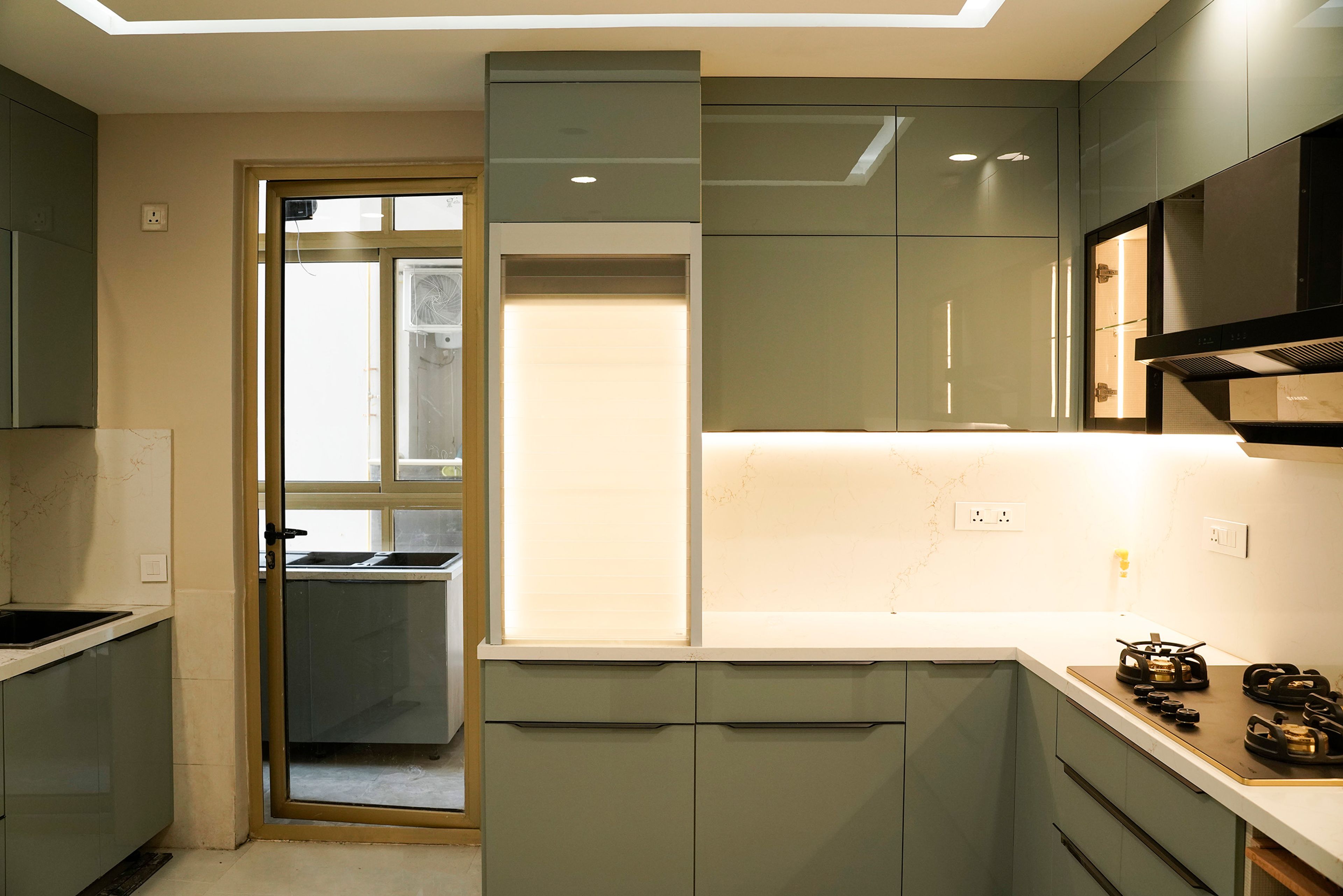 U-Shaped Kitchen Design with Green Units and Under Cabinet Lighting