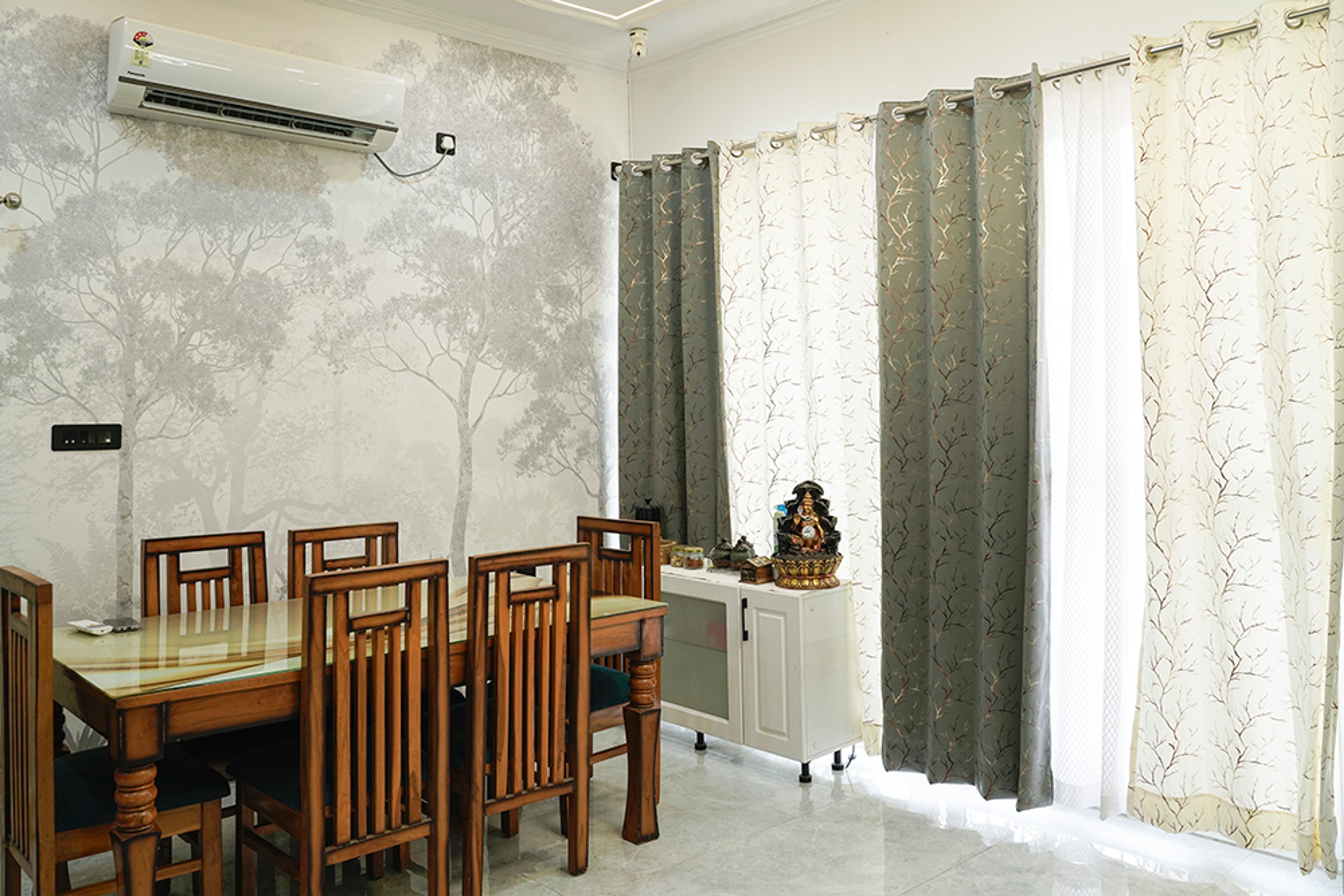 Dining Room Design with Wooden Dining Table and Tree-Themed Wallpaper