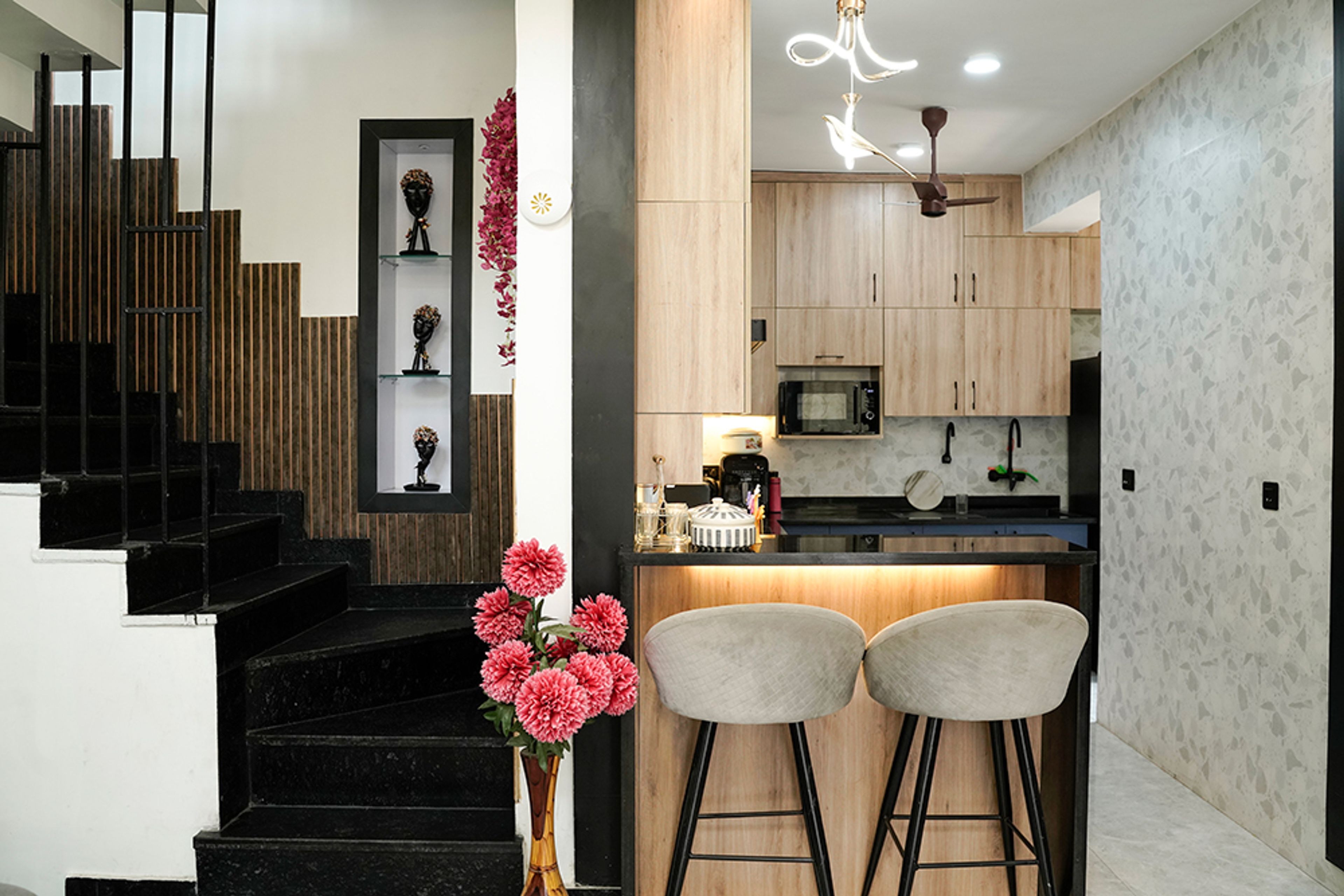 Staircase Design with Wooden Wall Panelling and Display Shelves