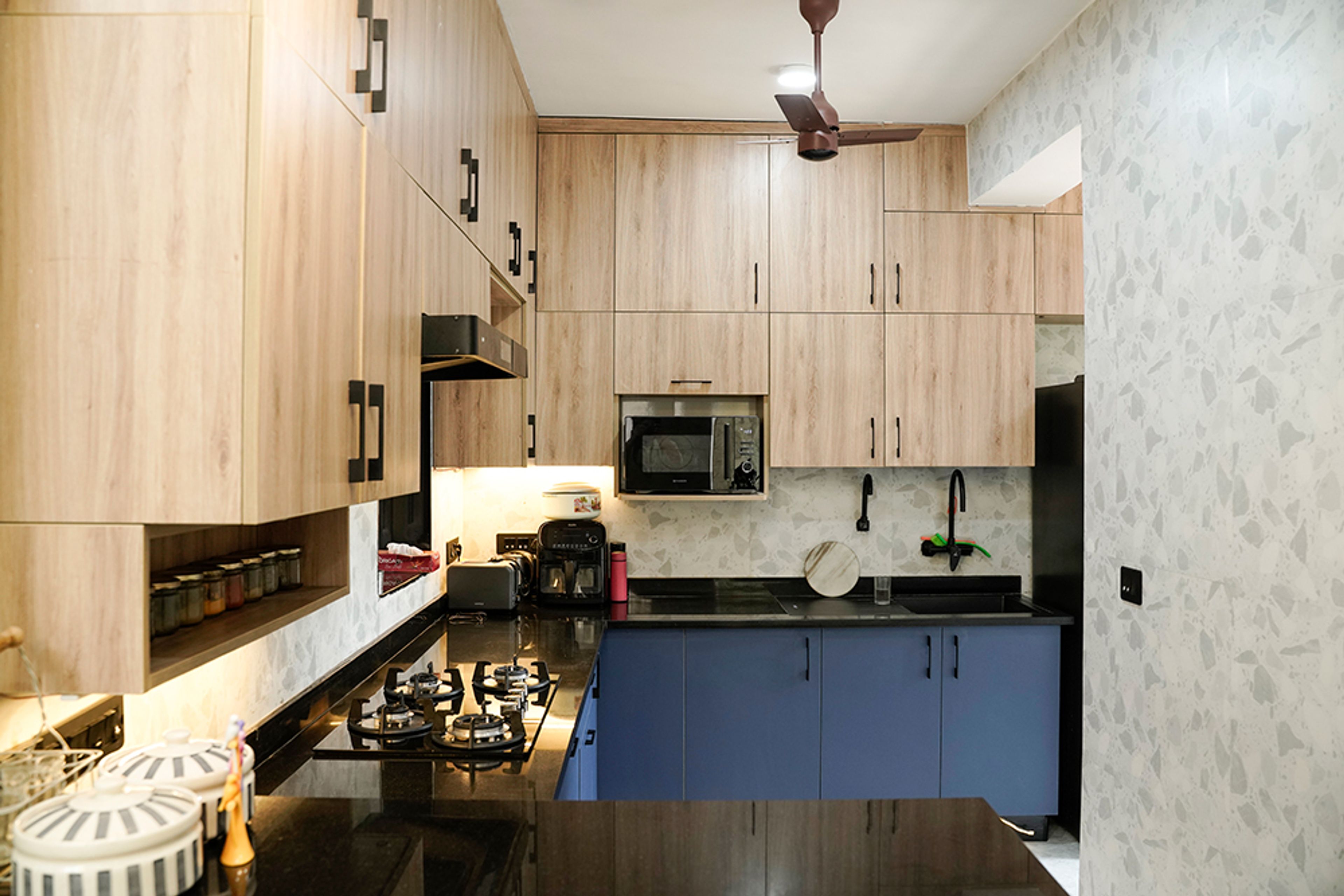 U-Shaped Kitchen Design with Wooden Upper Cabinets and Blue Base Cabinets