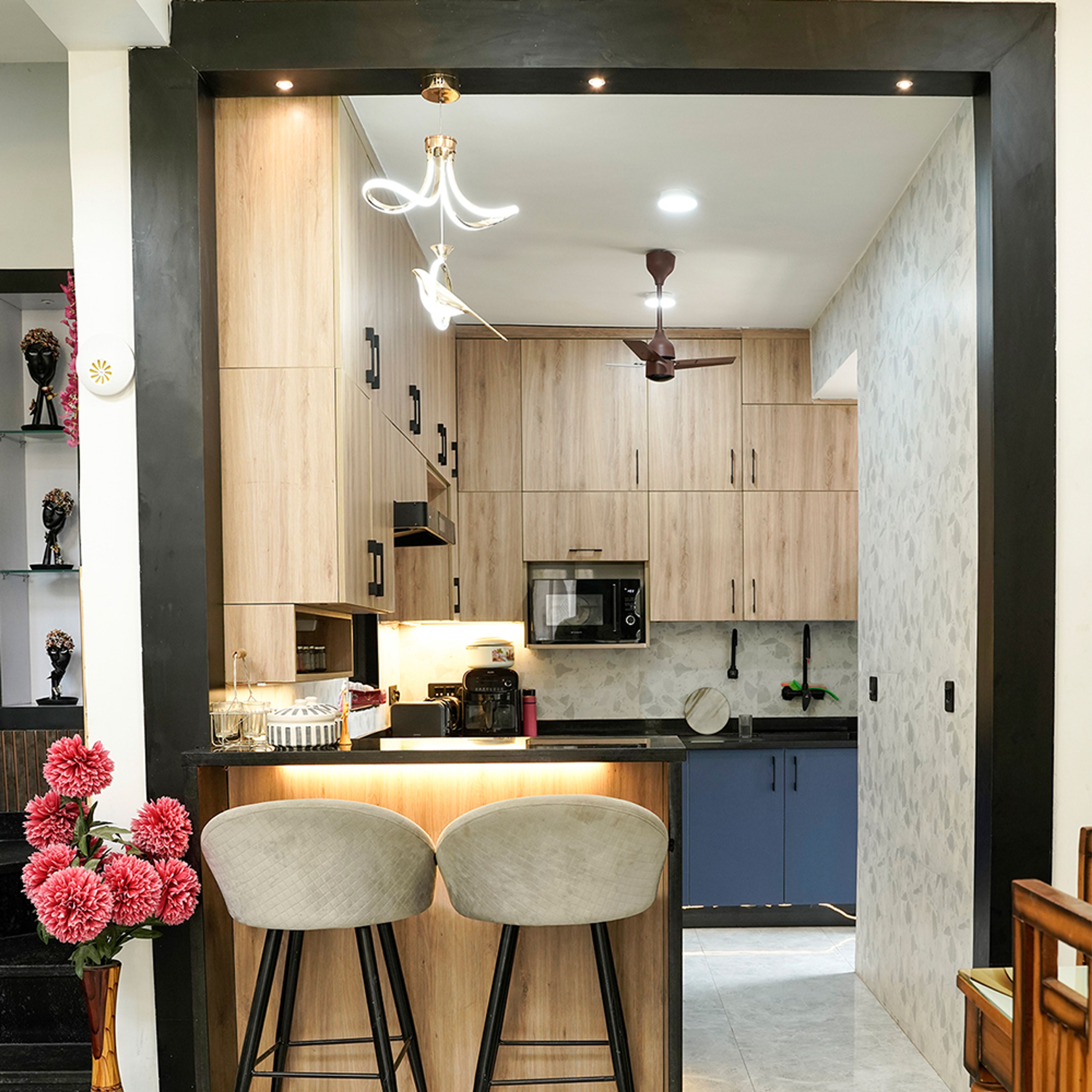 U-Shaped Kitchen Design with Wooden and Blue Cabinets and Breakfast Counter