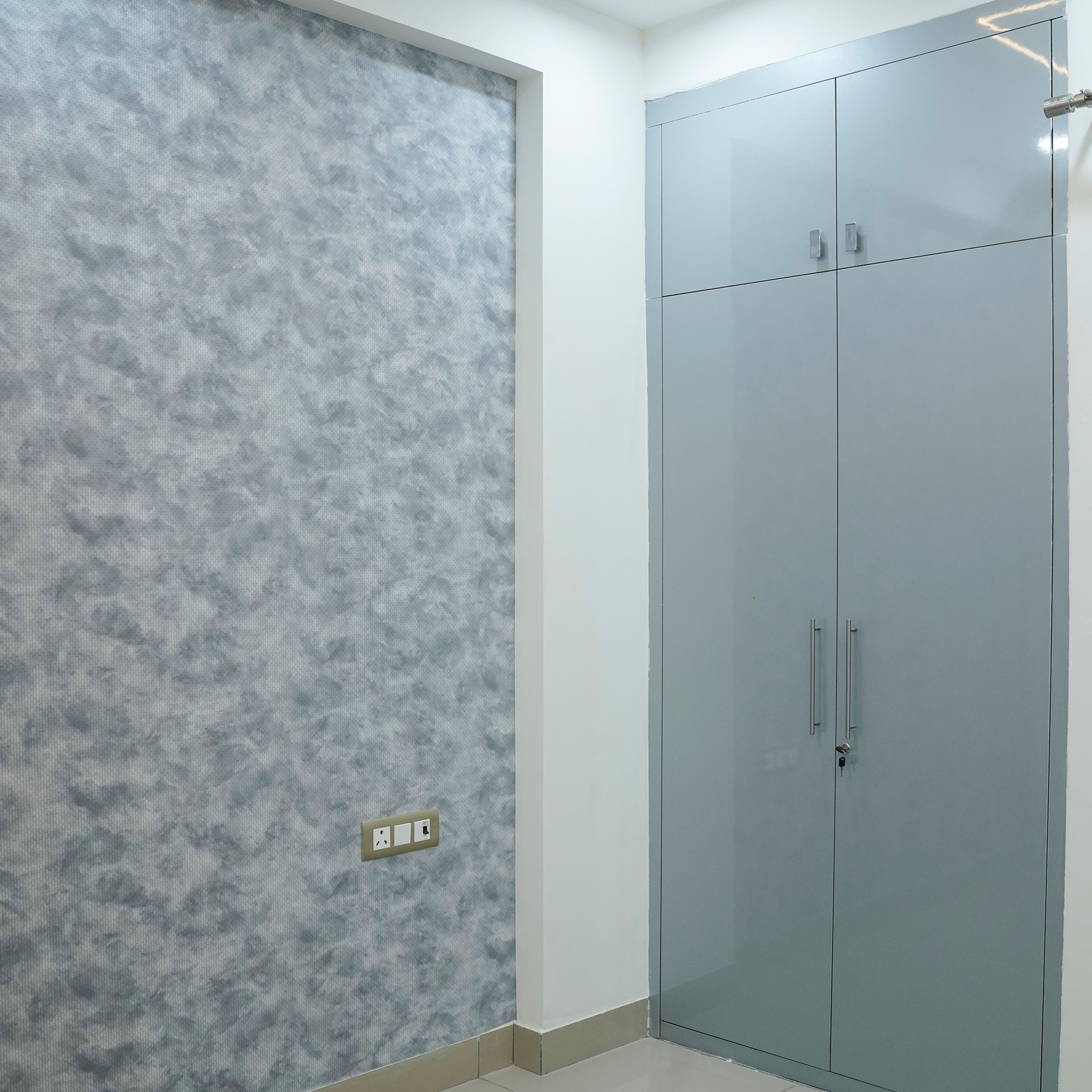 Blue Textured Wall Design with Blue 2-Door Swing Wardribe