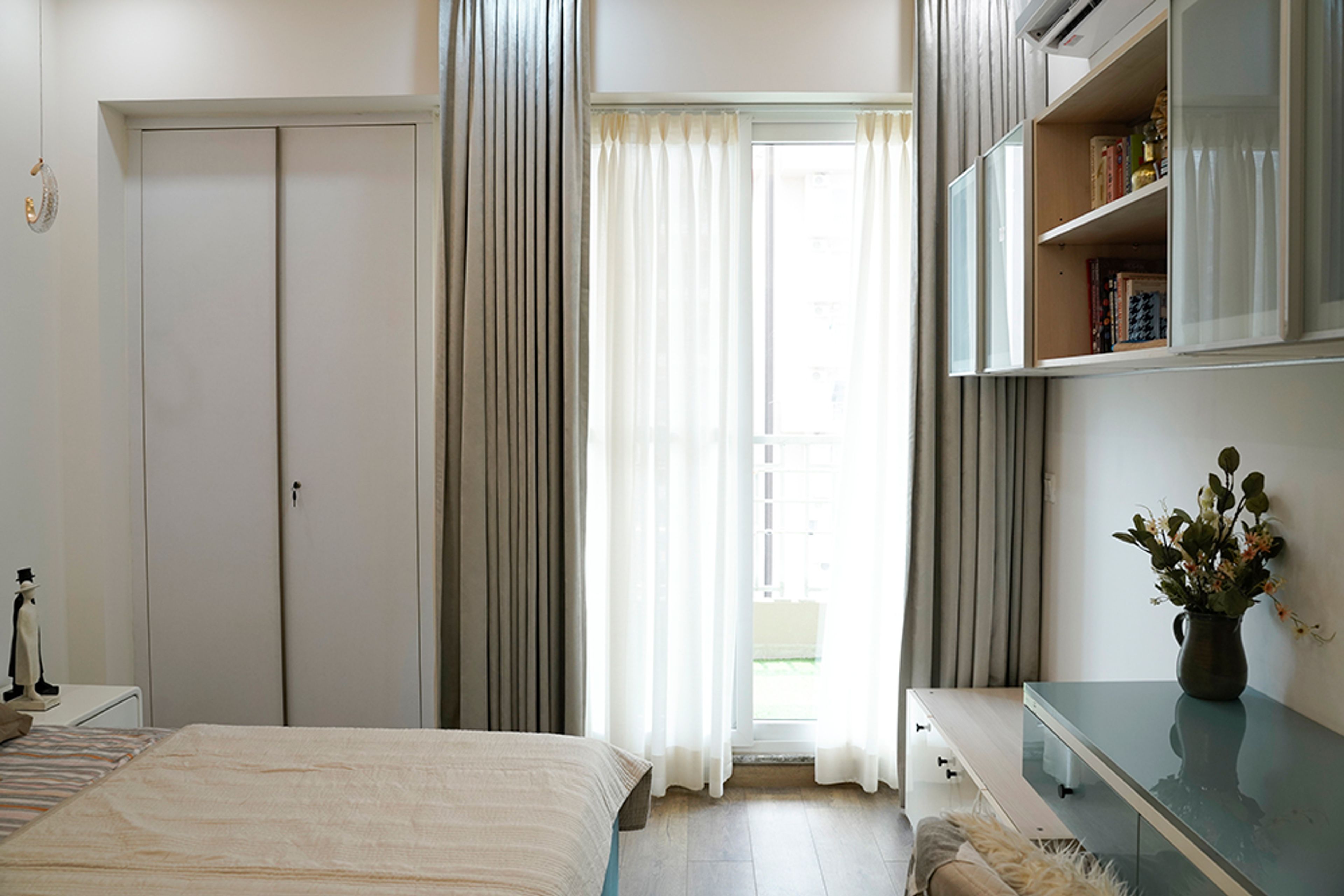 Modern Bedroom Design with White Wardrobe in Noida 4BHK Apartment