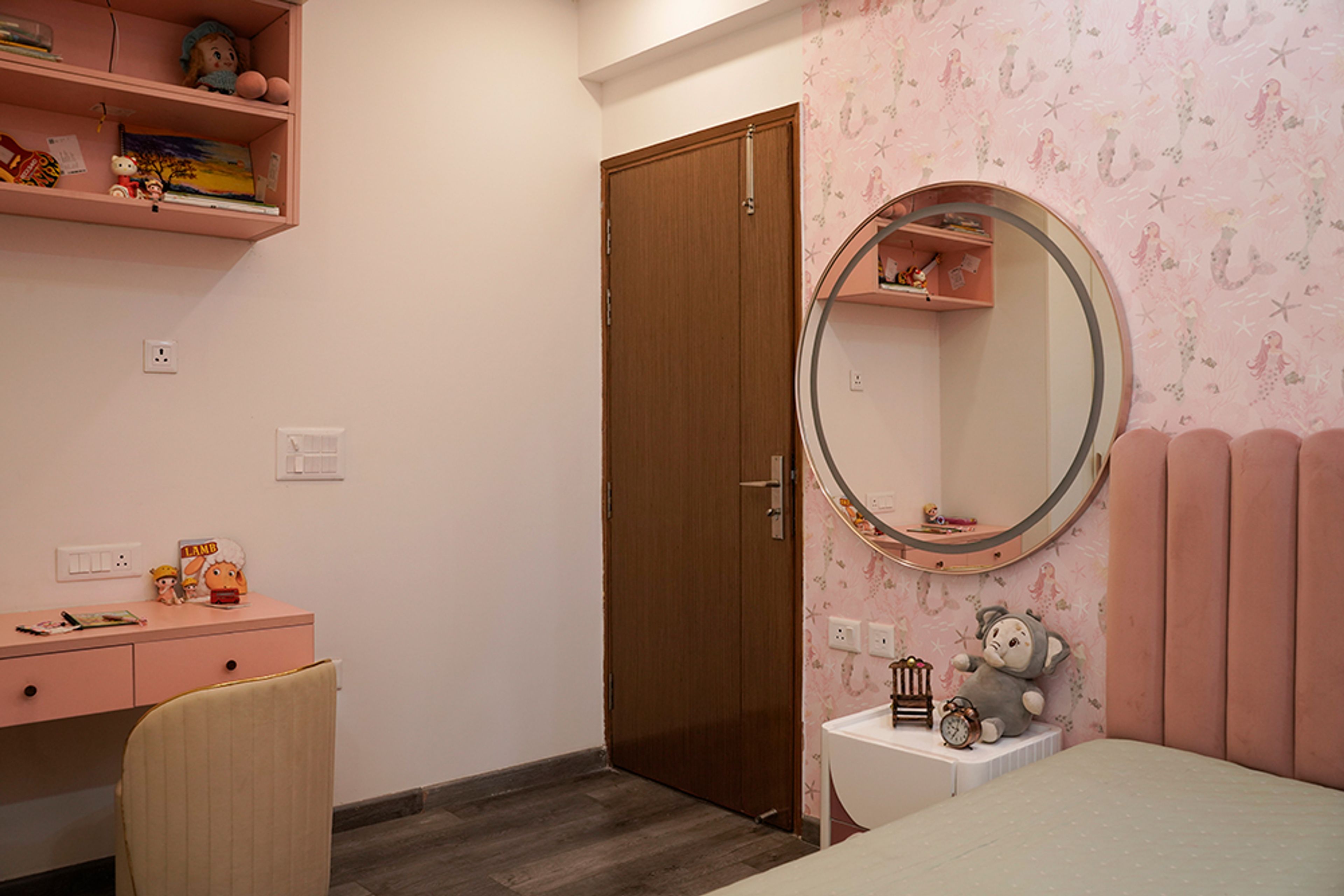Modern Kids Bedroom Design with Pink Wall and Round Mirror in Noida 4BHK Apartment