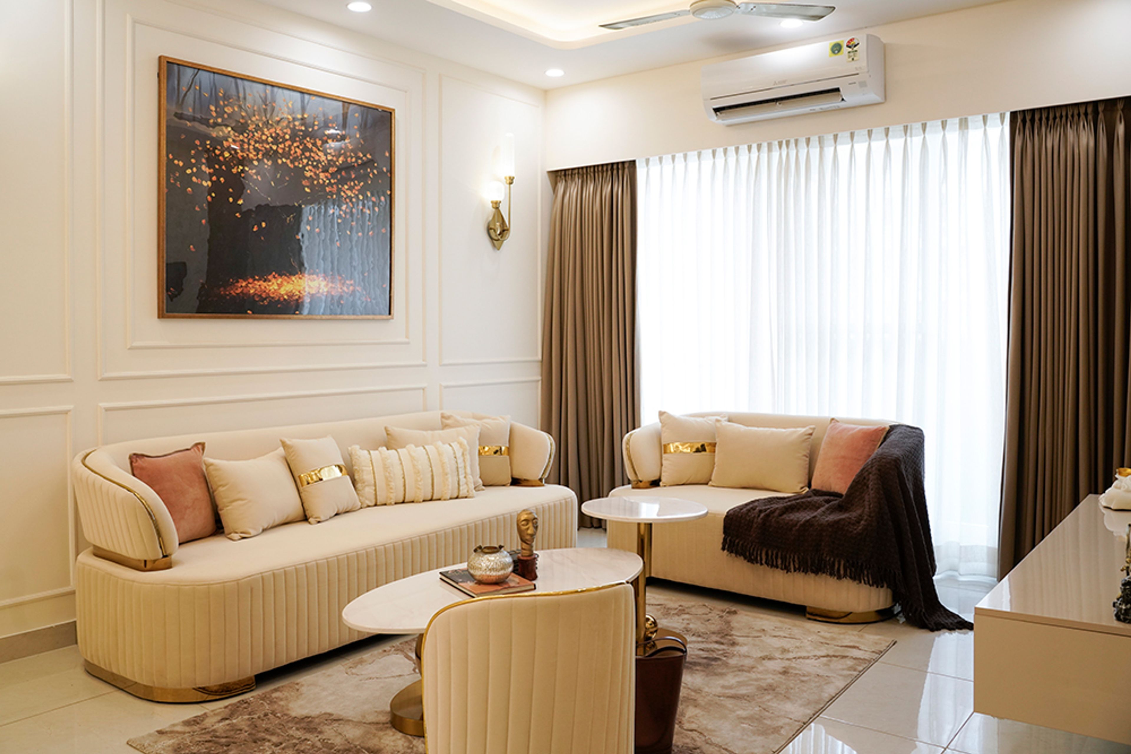 Modern Living Design with Beige Sofas in Noida 4BHK Apartment