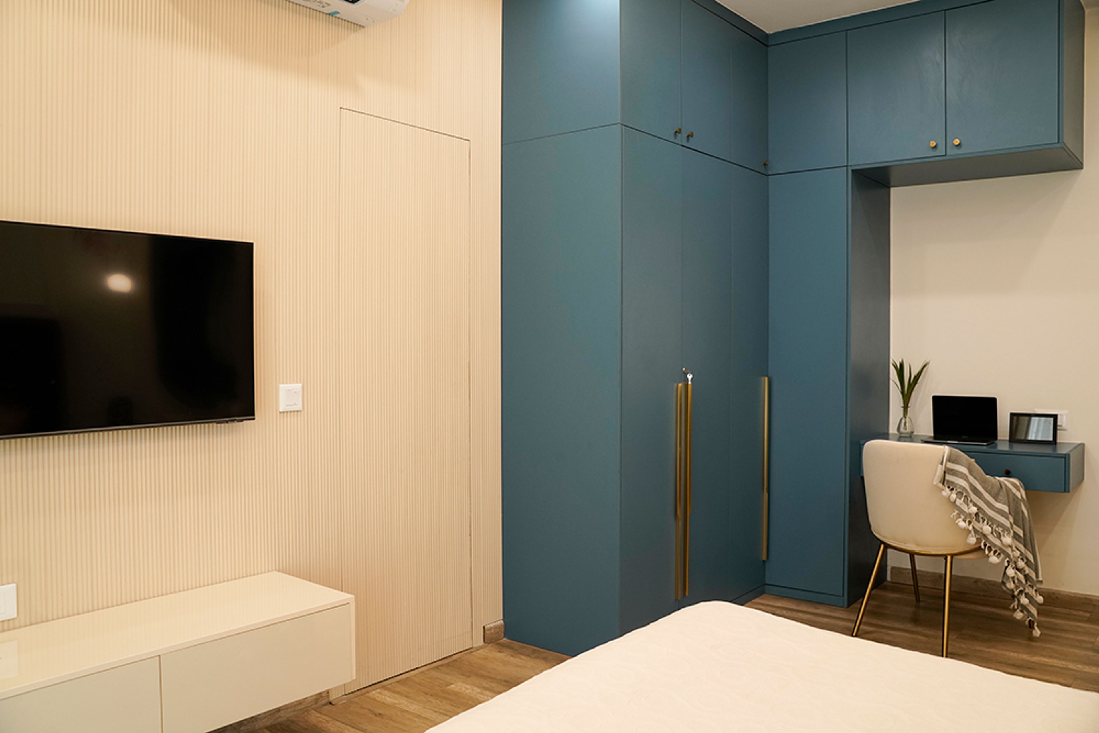 Modern Bedroom Design with Blue Wardrobe in Noida 4BHK Apartment