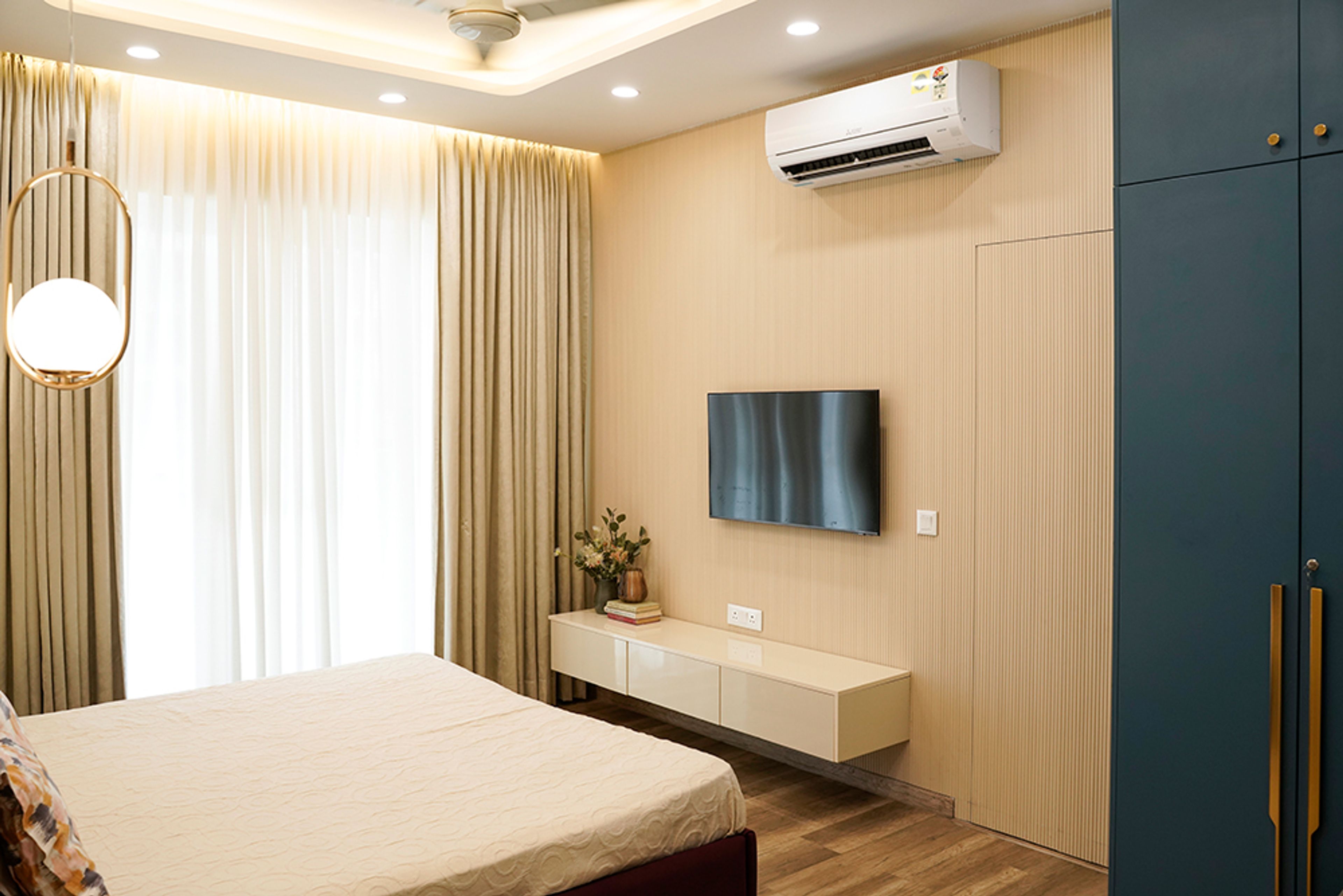 Modern Bedroom Design with TV Unit in Noida 4BHK Apartment