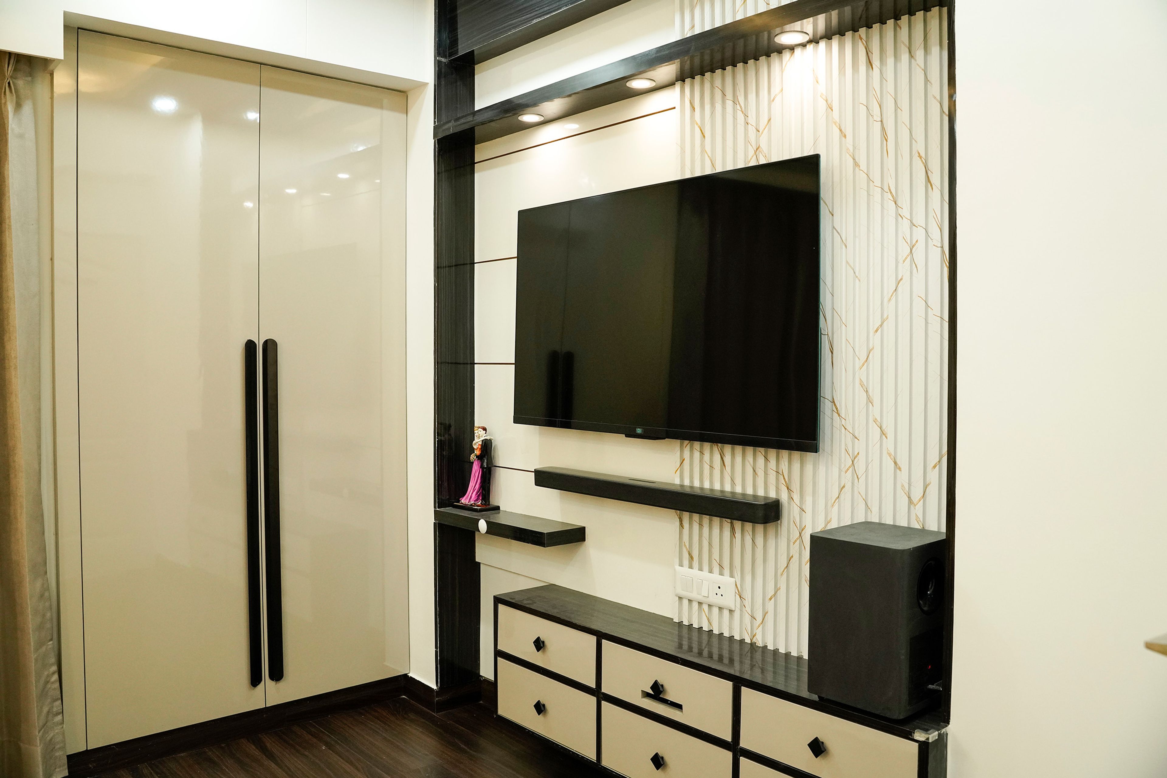 TV Unit Design with Patterned and Panelled Backsplash Wall and 2-Door Swing Wardrobe