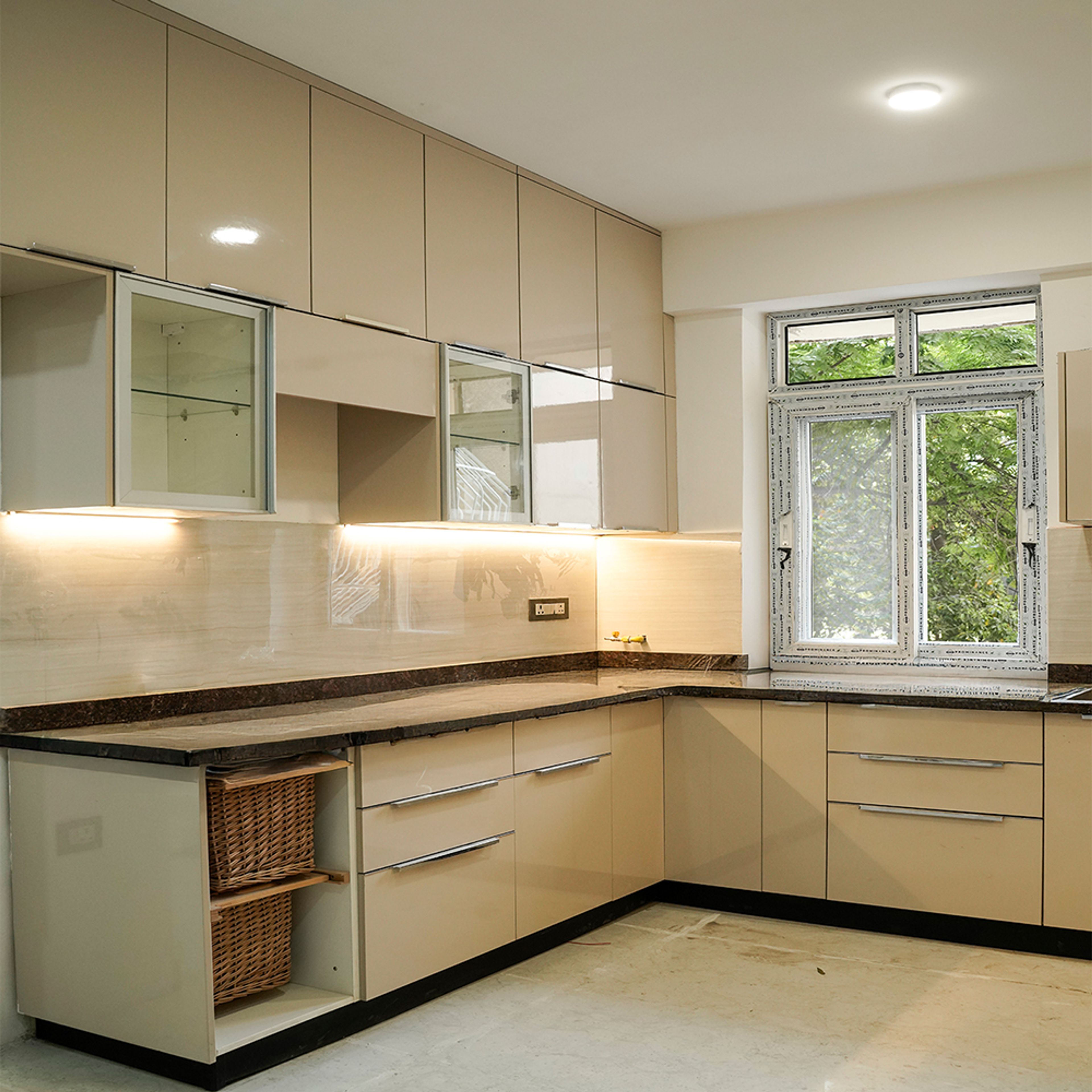 L-Shaped Kitchen Design with Cream Units and Under Cabinet Lighting