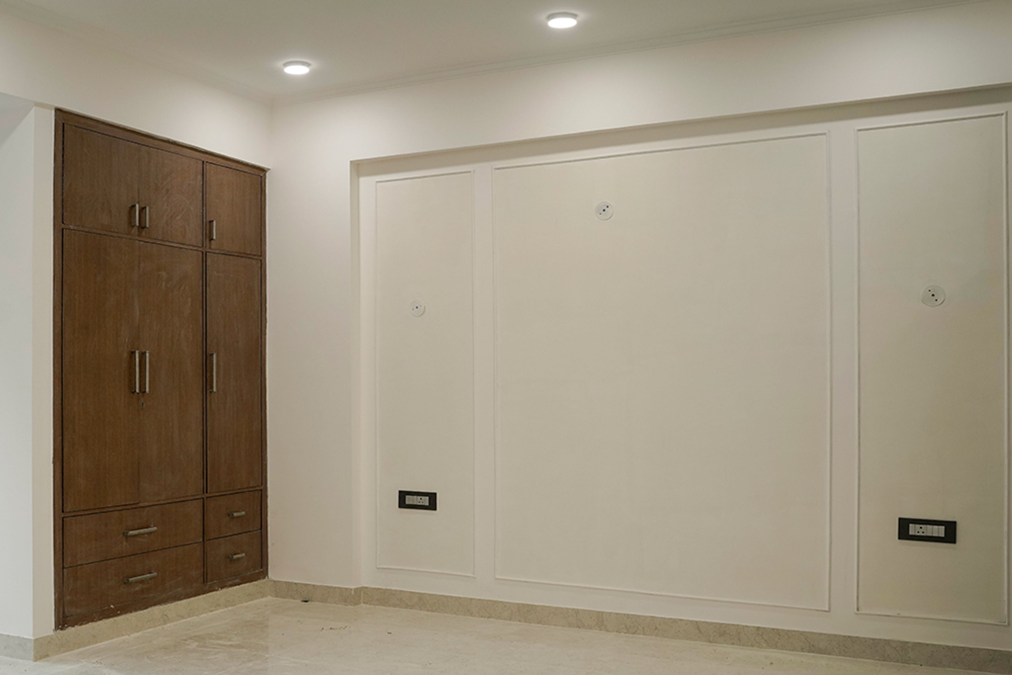 Bedroom Design with Cream Wall with Trims and Wooden 3-Door Swing Wardrobe