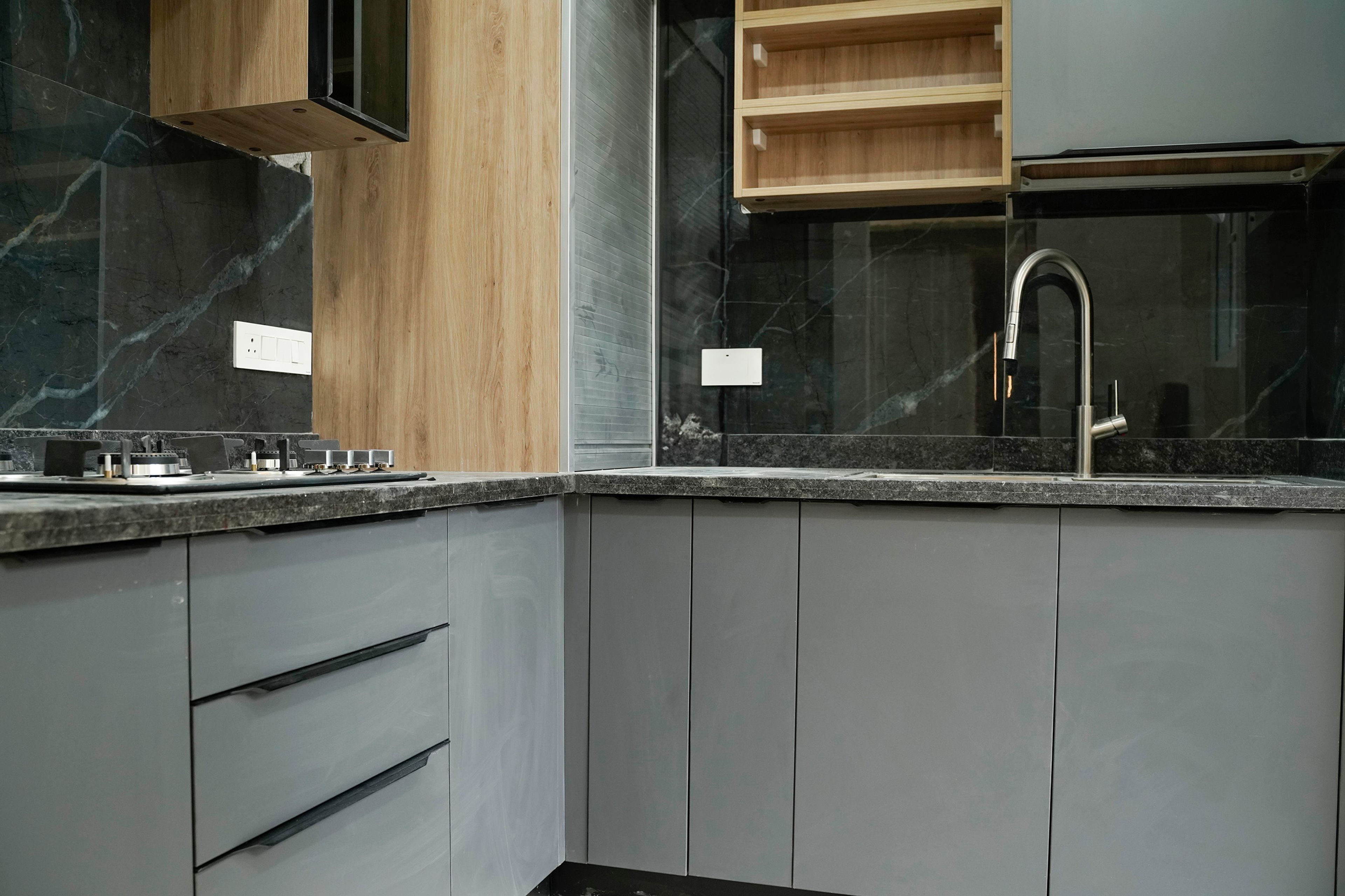 L-Shaped Kitchen Design with Grey Units and Granite Backsplash and Countertop