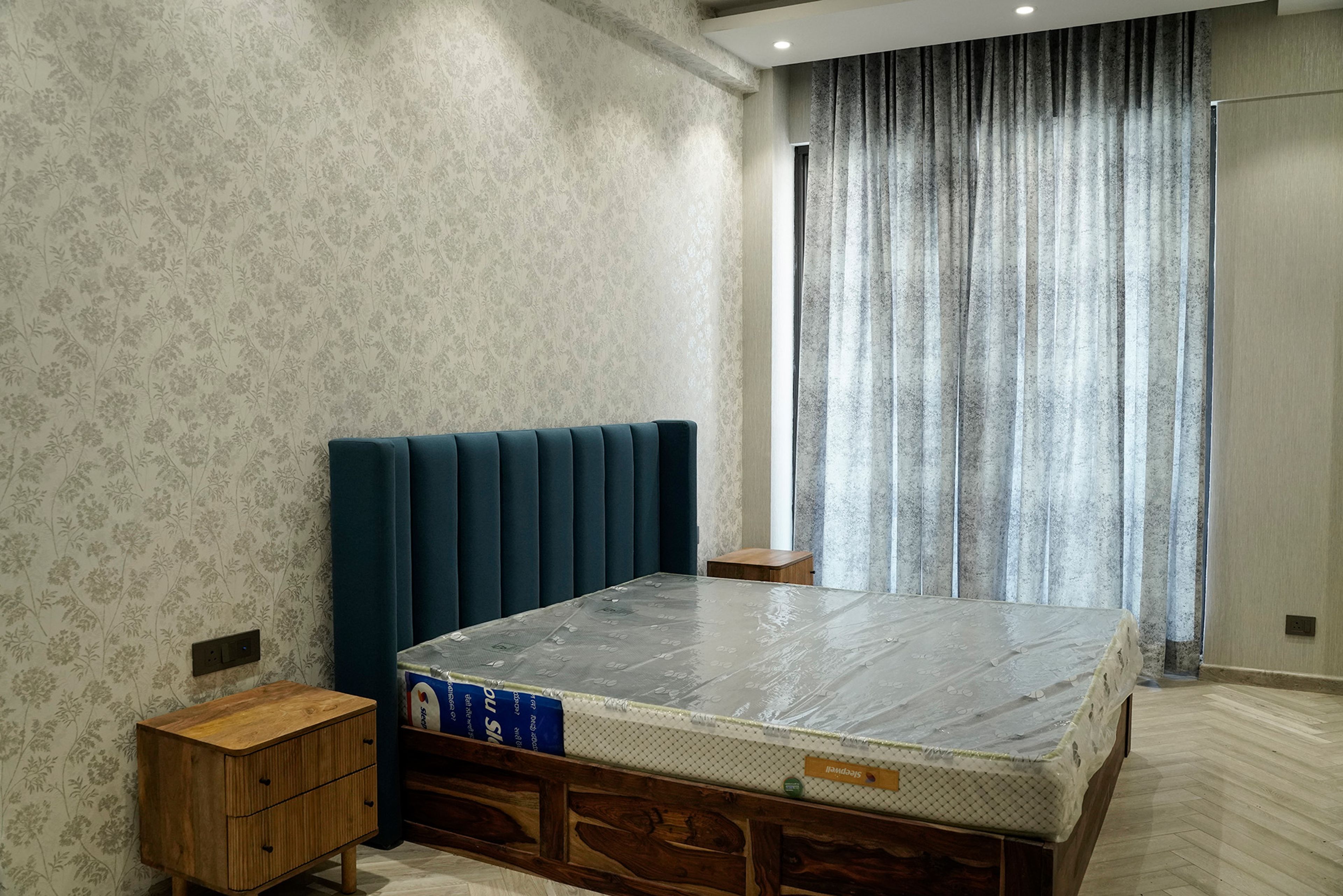 Bedroom Design with Blue and Grey Floral Pattern Wallpaper and Teal Tufted Headboard Bed