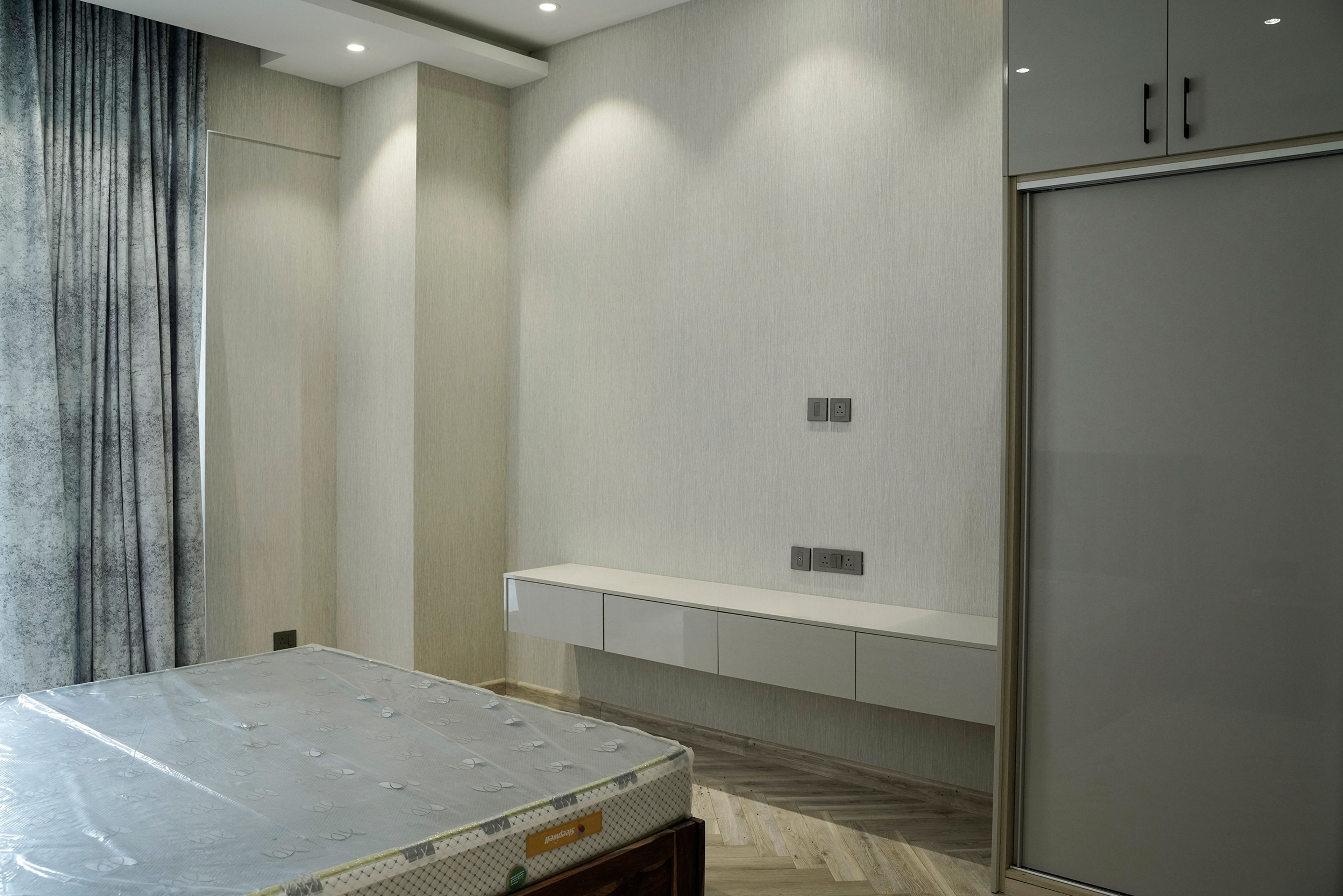 Bedroom Design with Grey Textured Wall TV Unit