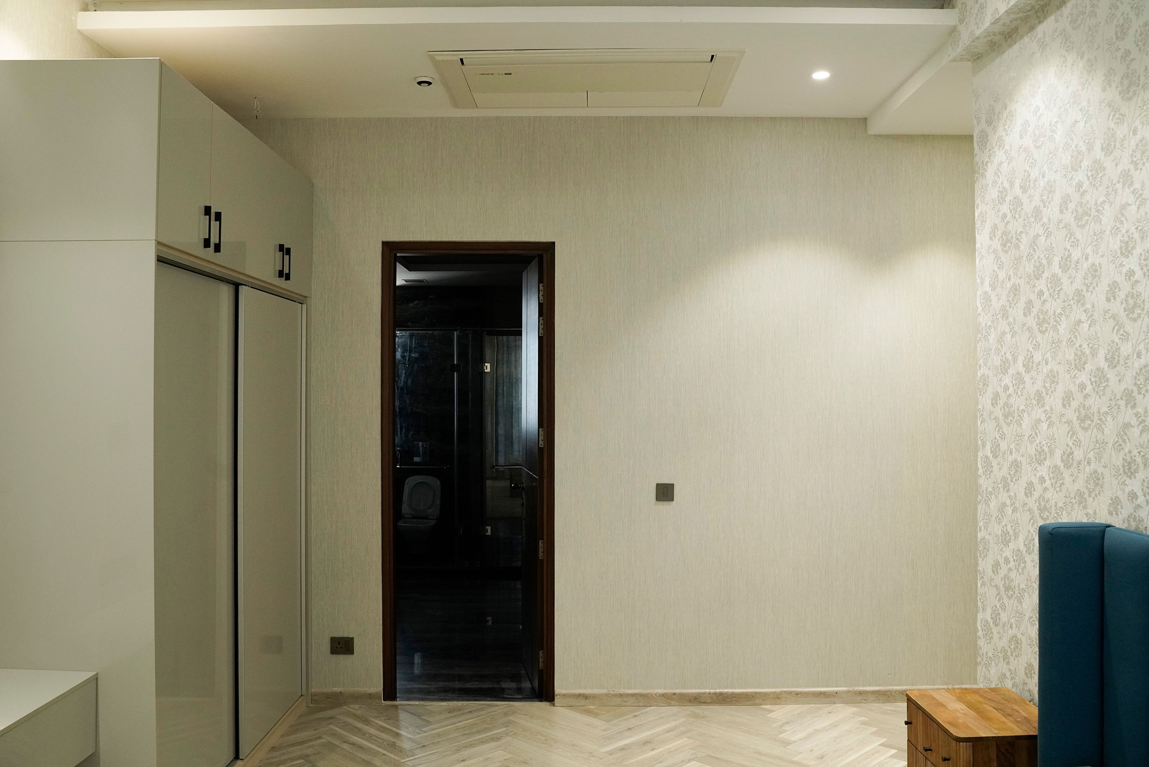 Bedroom Design with Grey Textured Wall and 2-Door Grey Sliding Wardrobe