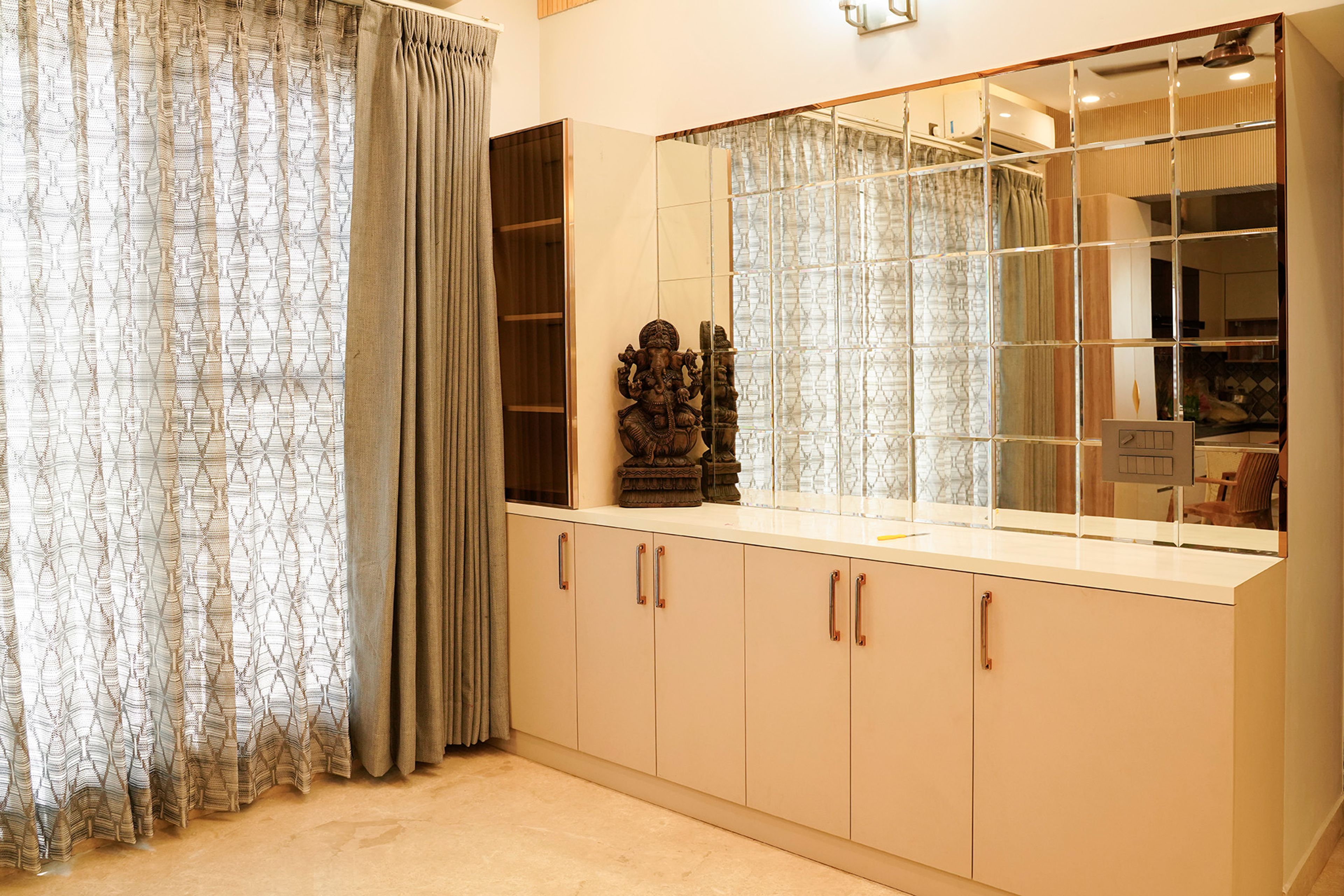 Crockery Unit Design with Light Pink Cabinets, Glass Shutter Tall Unit and Mirror Backsplash