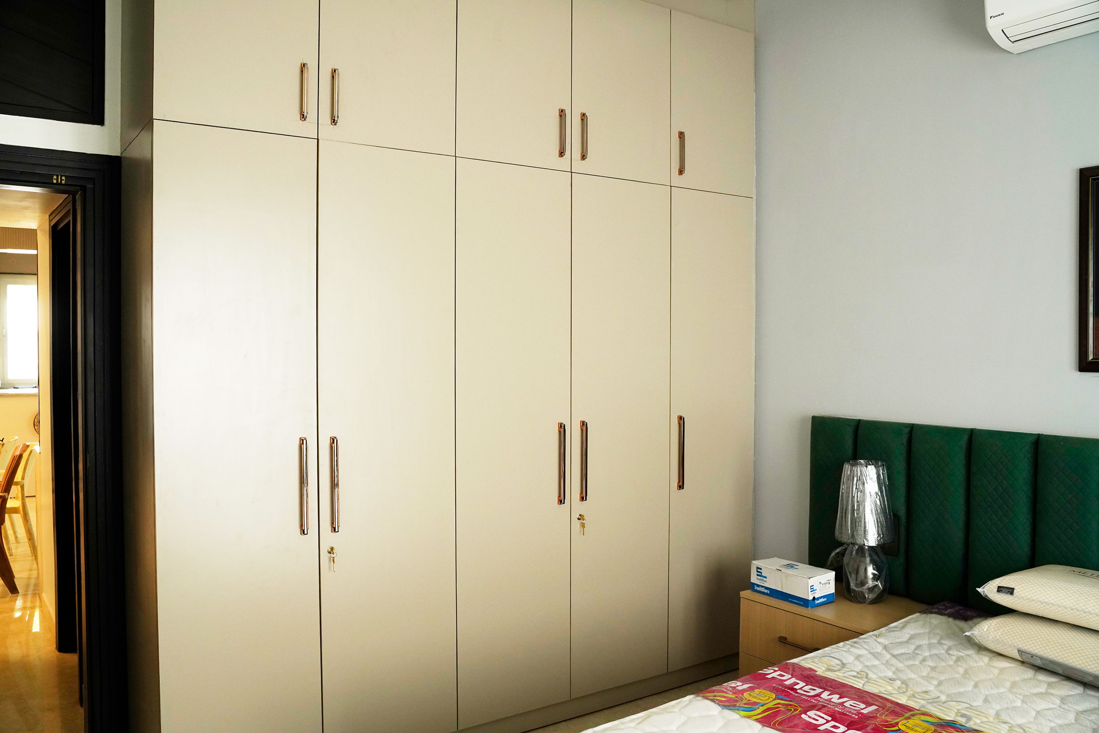 Cream 5-Door Swing Wardrobe Design with Loft Unit