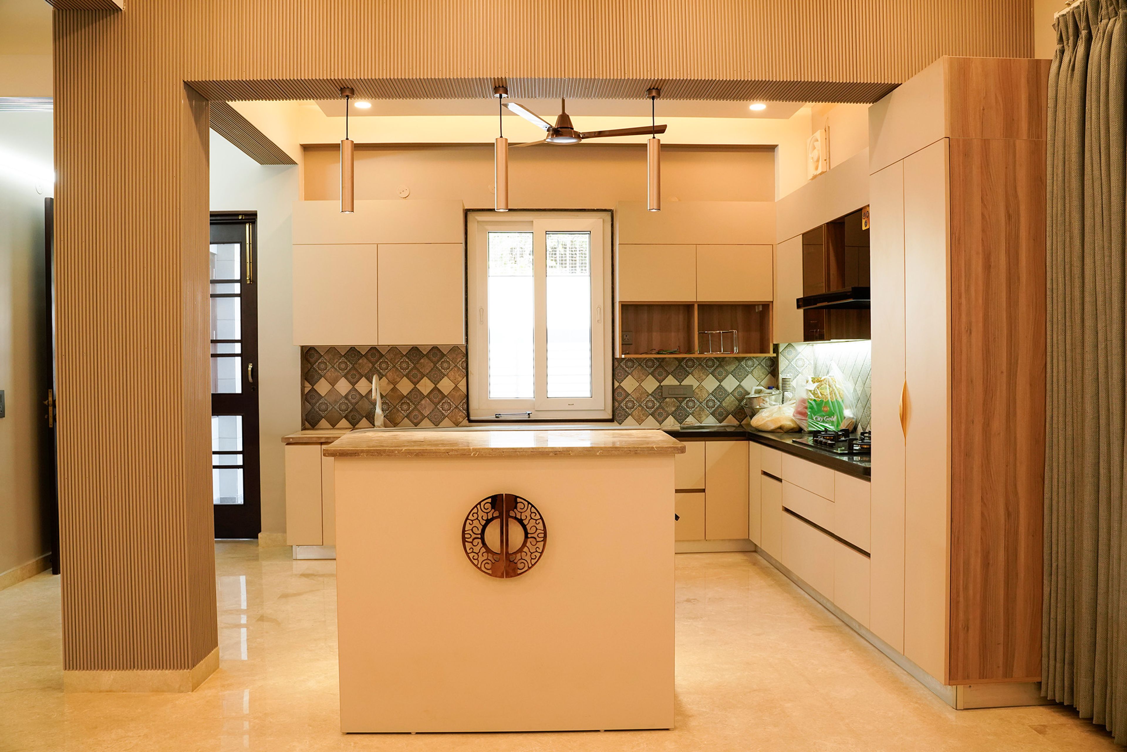 Island Kitchen Design with Moroccan Backsplash and Cream Units