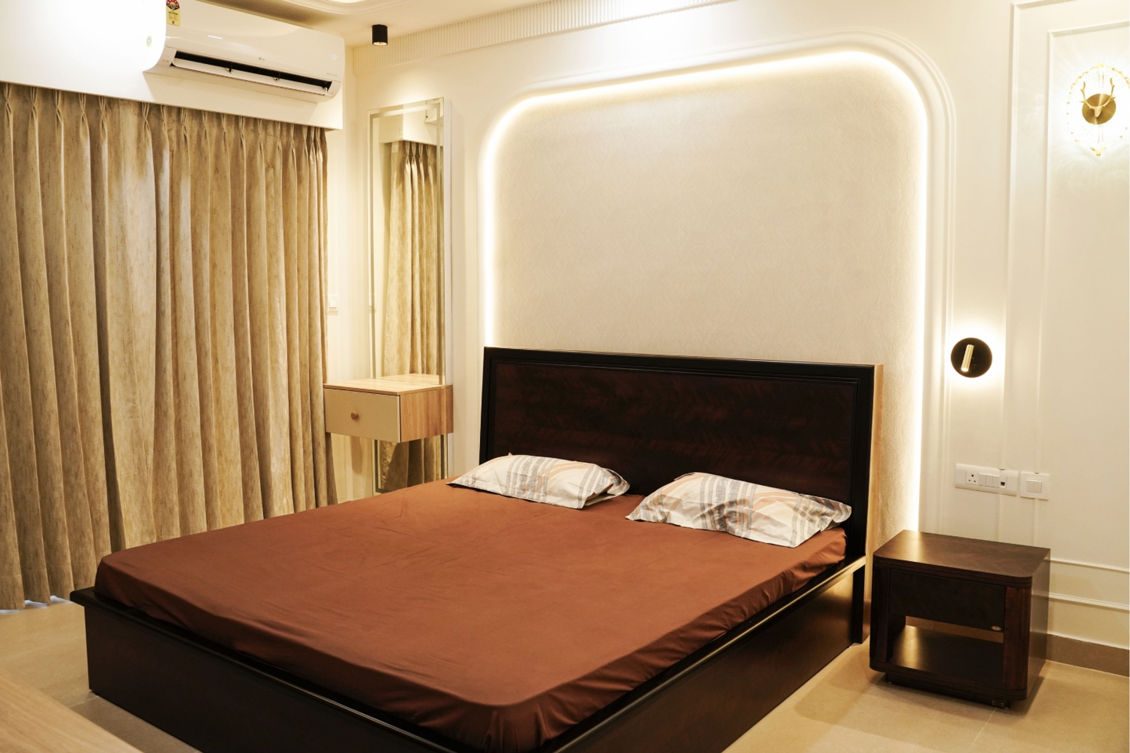 Master Bedroom Design with Beige Wall Panel, Cove Lights, and Wooden Bed