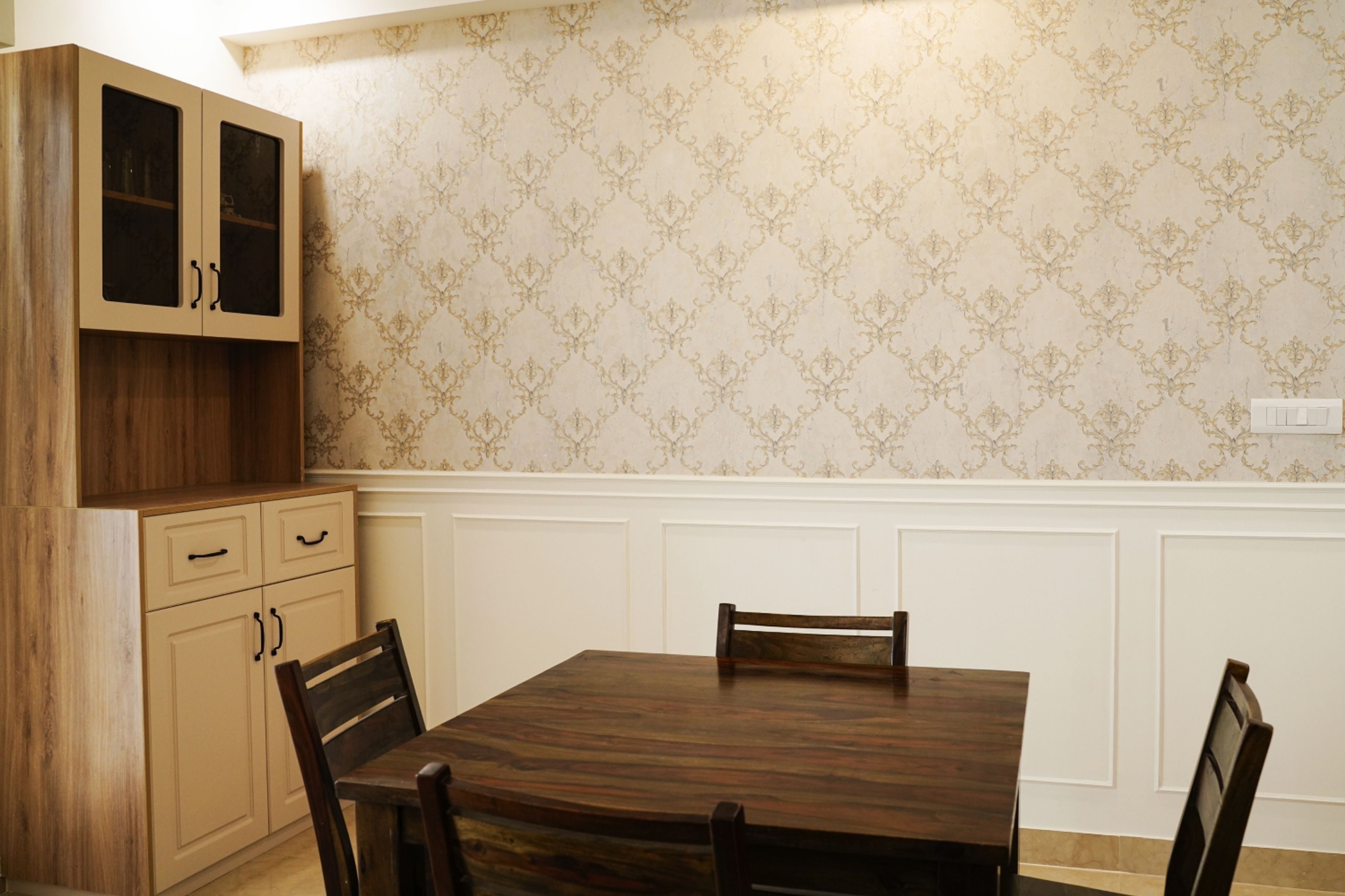 Dining Room Design with Wooden Table, Beige Wallpaper, and Crockery Unit