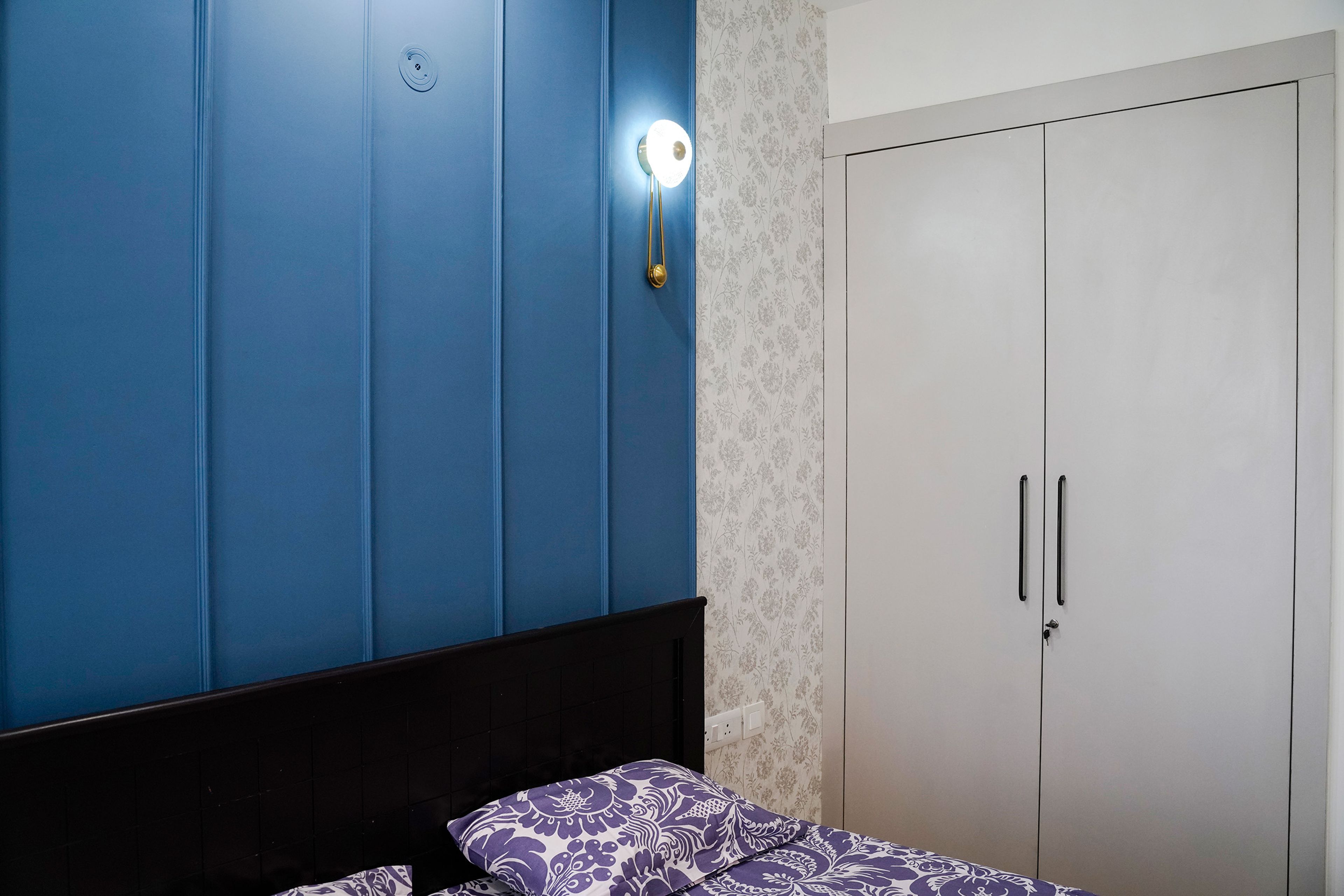 2-Door White Wardrobe Design beside Blue Wall Panel