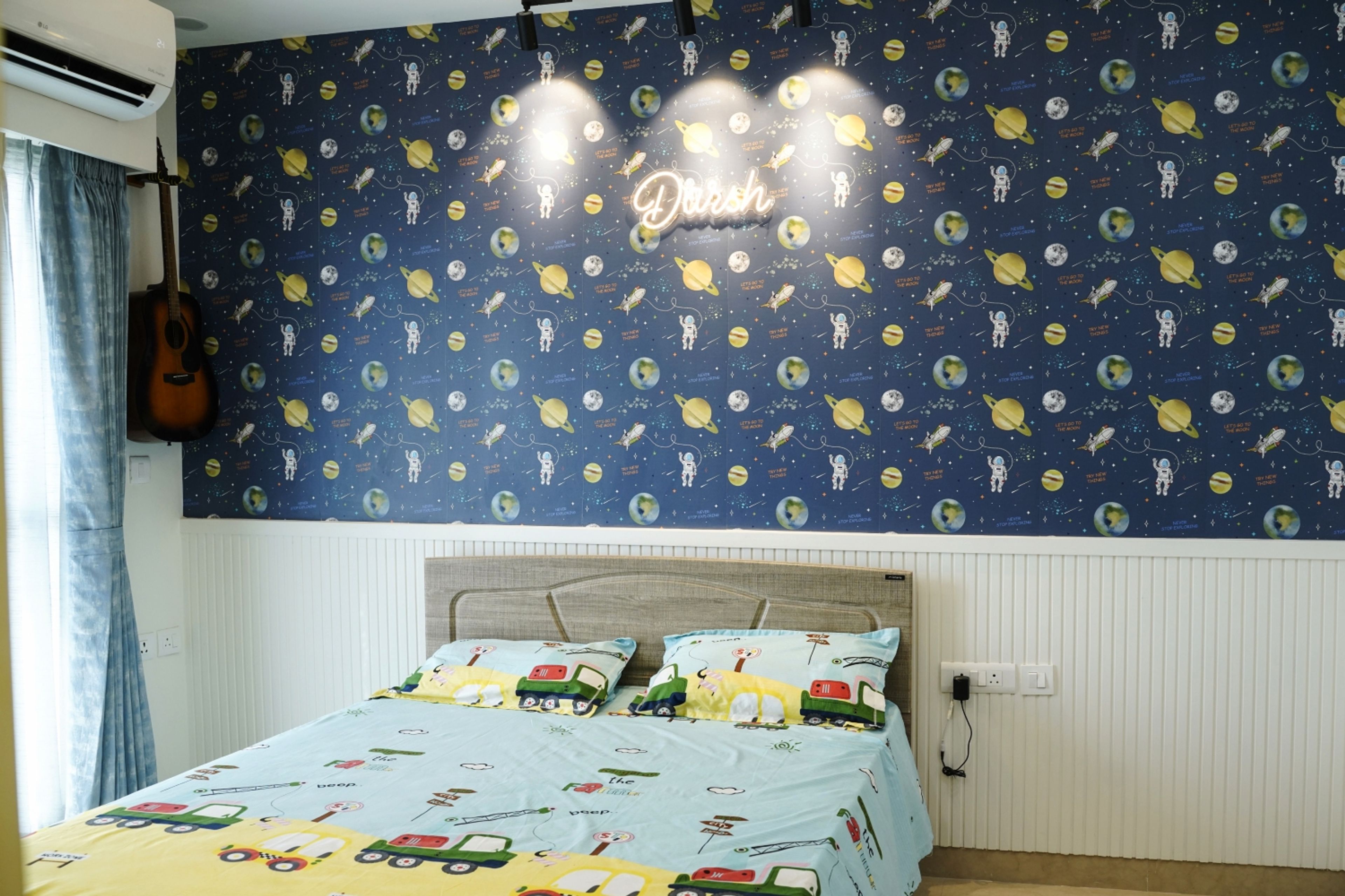 Kids Bedroom Design with Space Themed Wallpaper and Neon Name Light