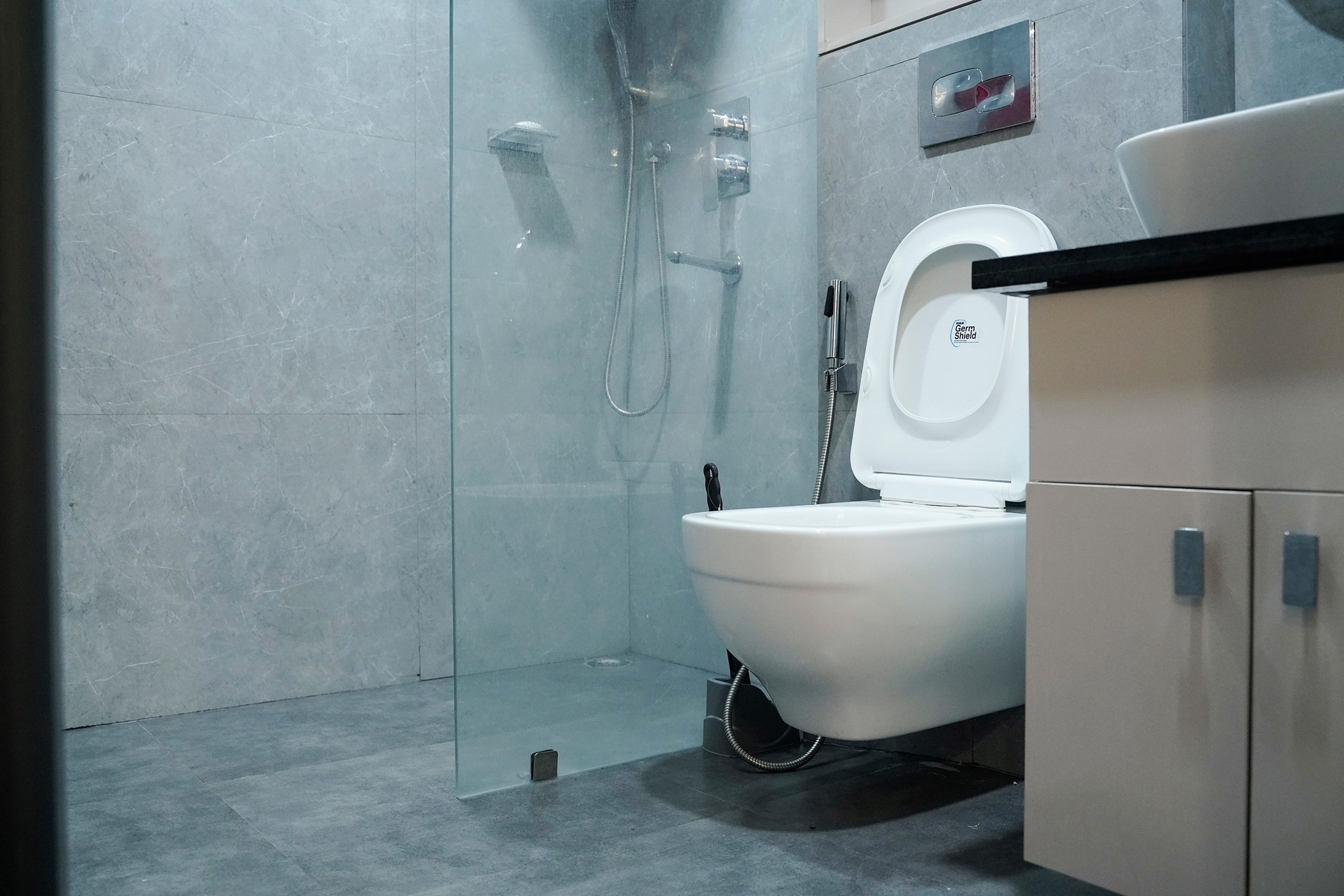 Bathroom design with grey tiles flooring and wall