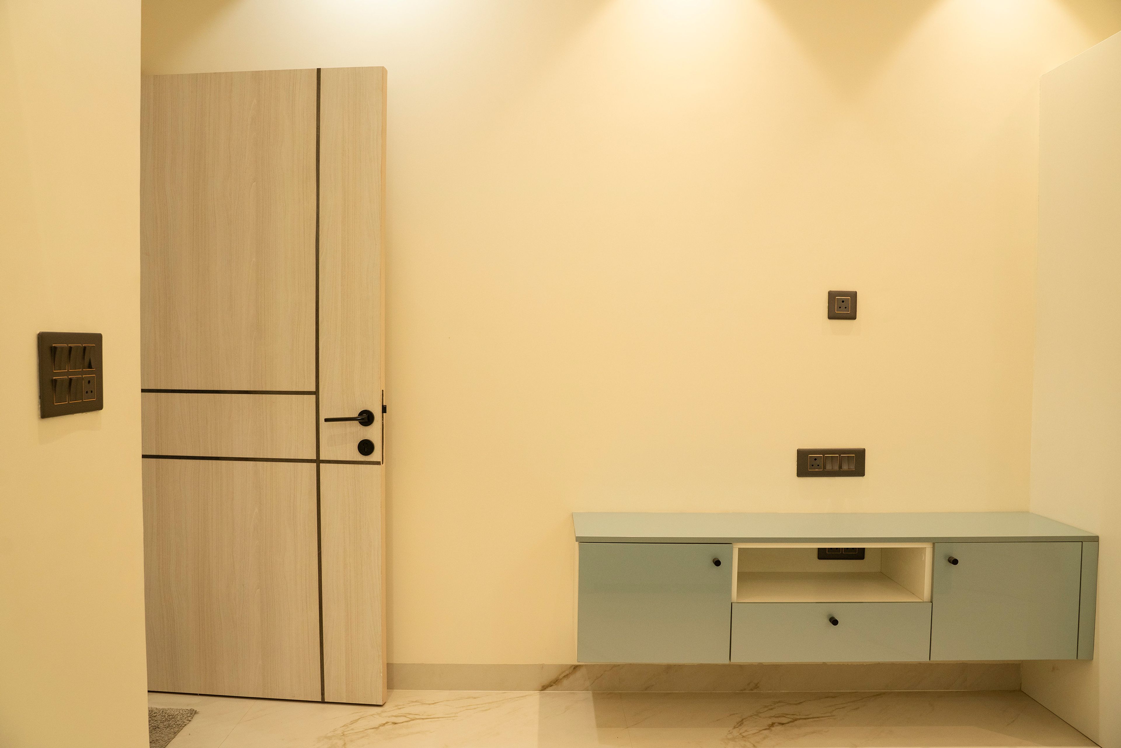 TV Unit design with blue wall mounted drawers