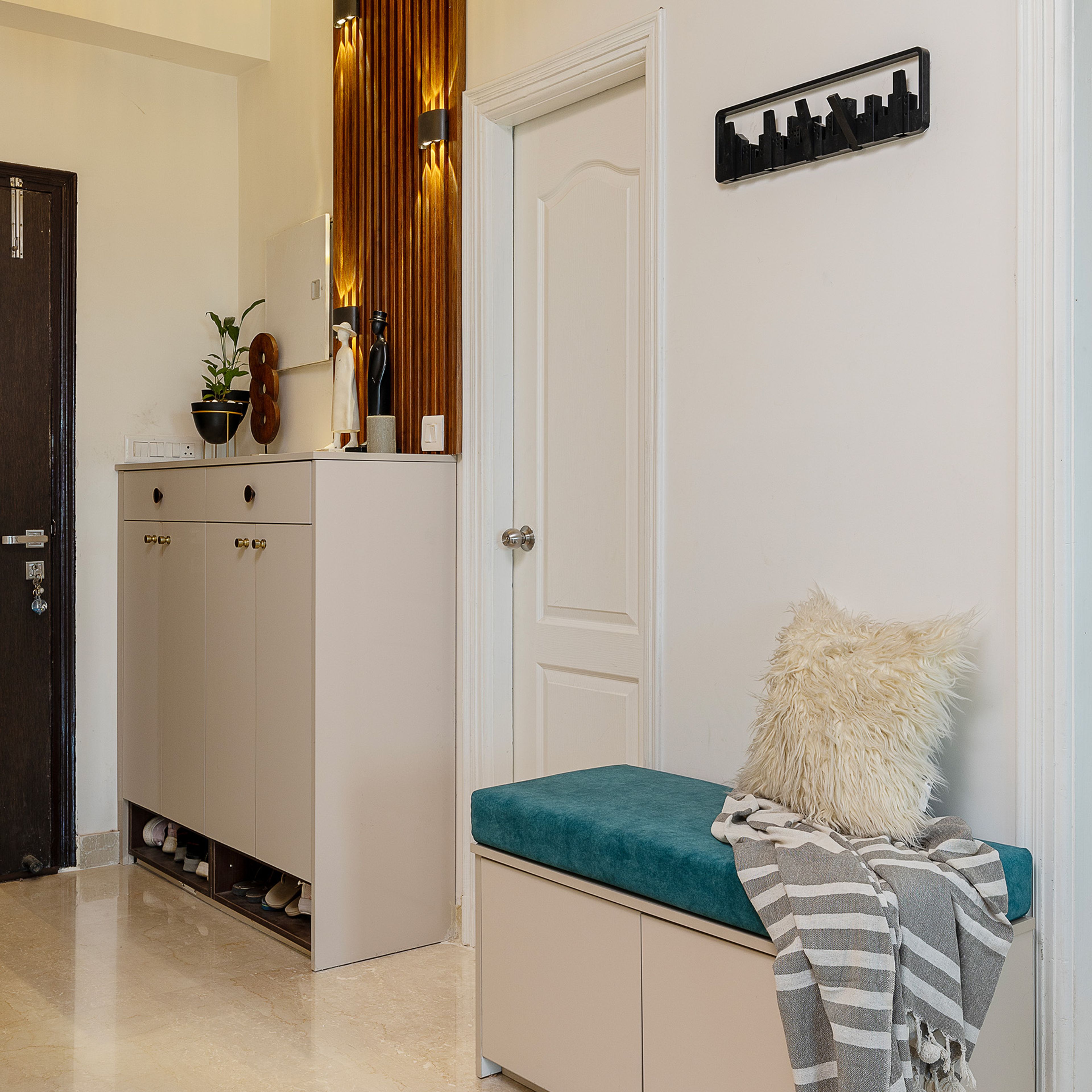 Foyer Design with Light Grey Shoe Cabinet and Blue Cushioned Bench