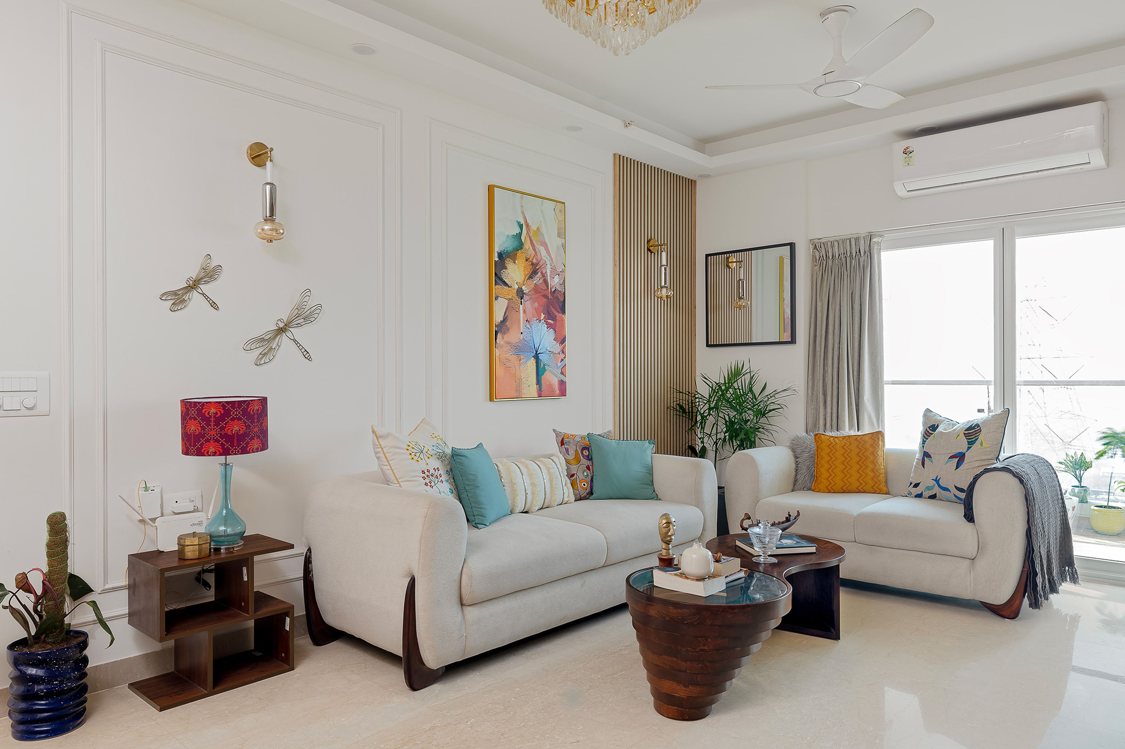 Living Room Design with White Sofas, White Wall with Trims and Golden Louvers