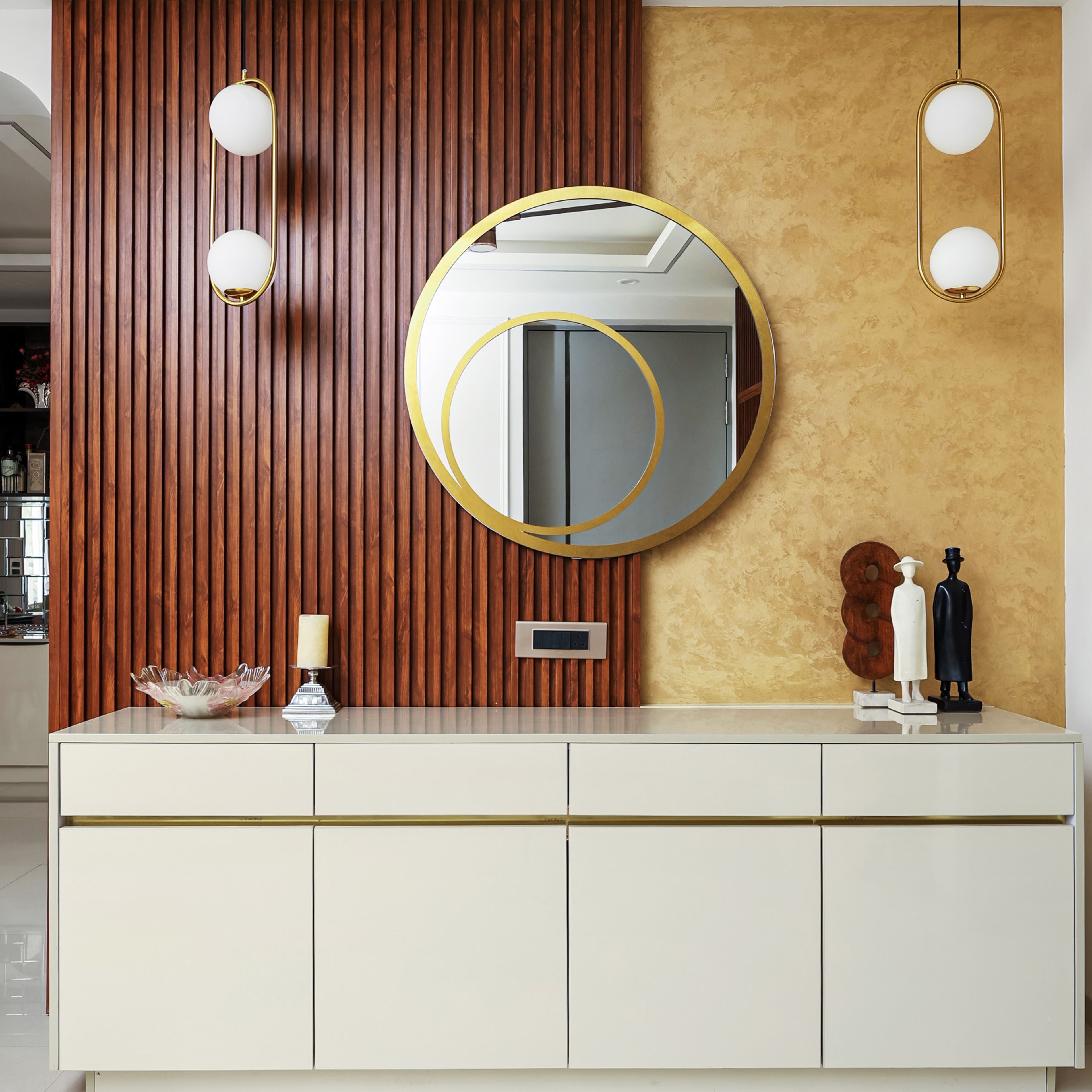 Off-White Storage Unit with Round Mirror and Brown Wall Louvers