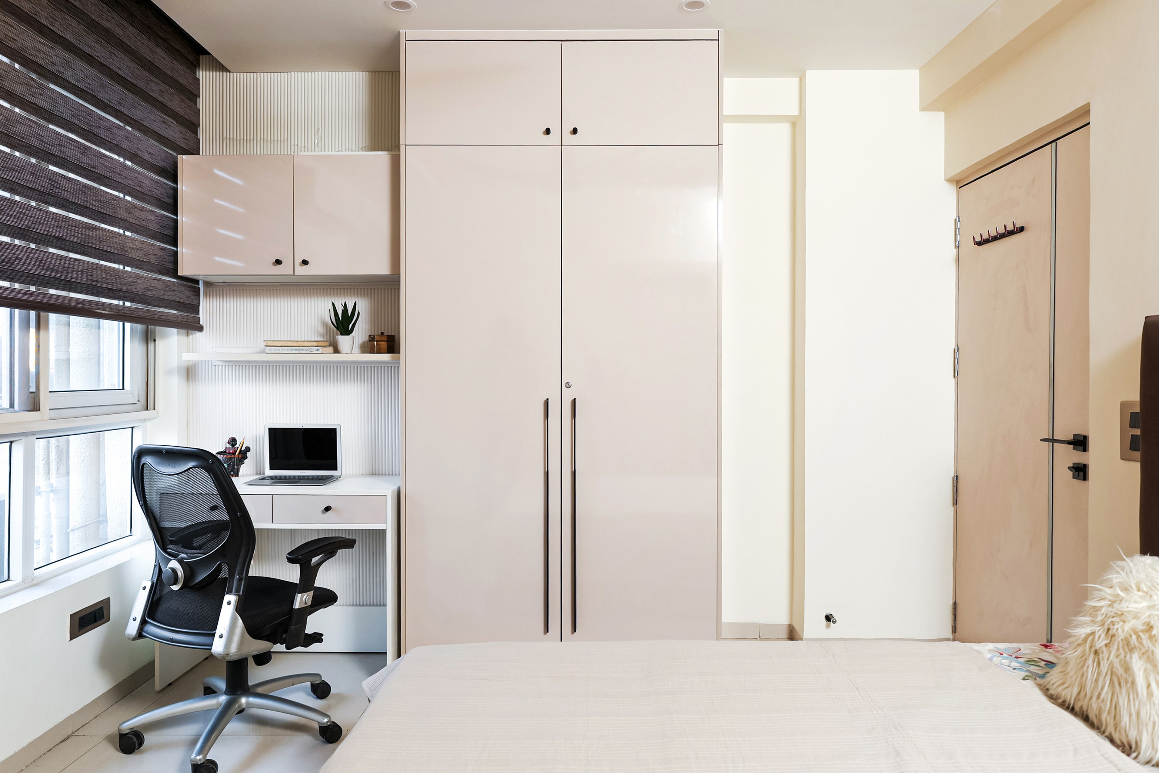 Bedroom Design with 2-Door Beige Swing Wardrobe and White Study with Black Chair