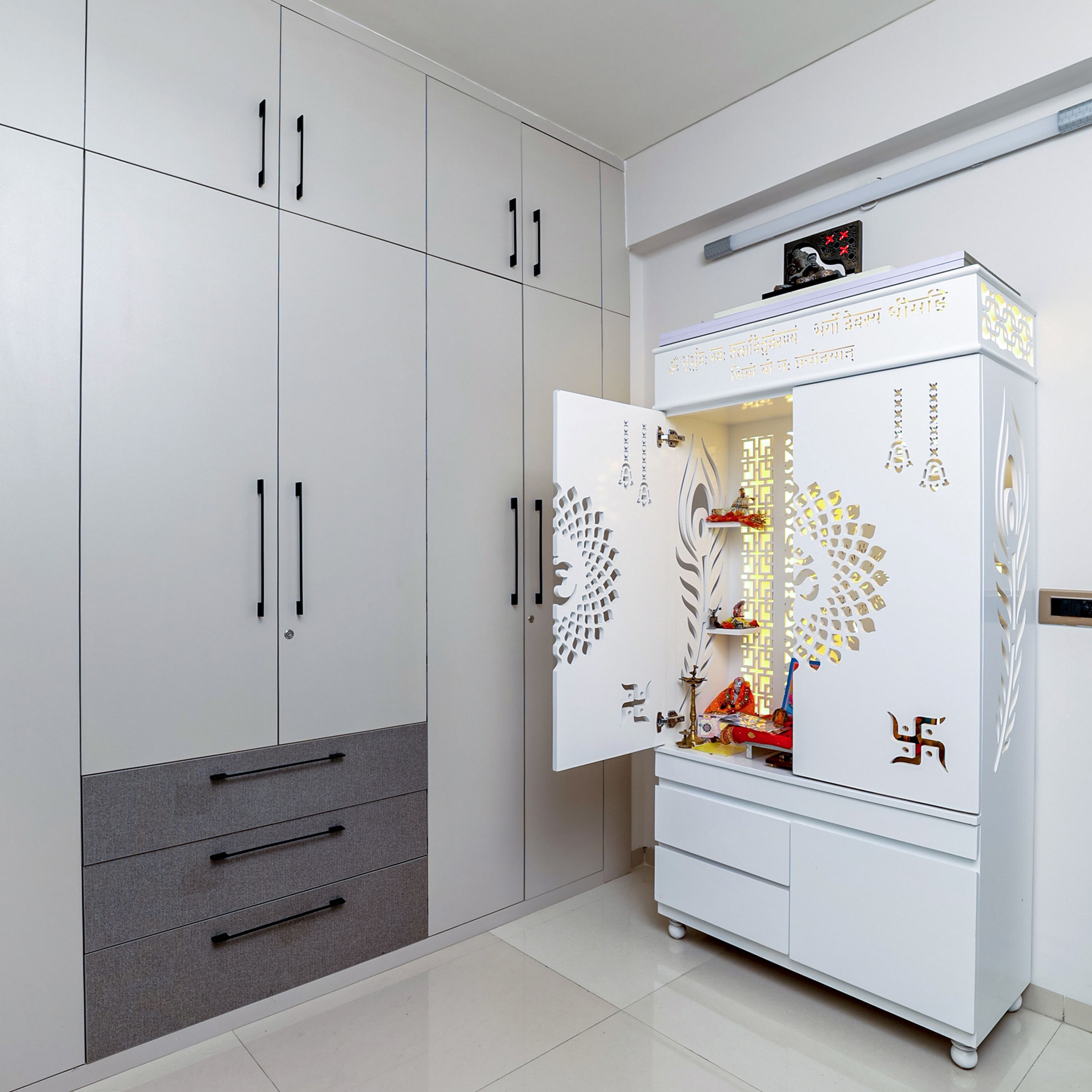 4-Door White Swing Wardrobe with Drawers and White CNC Cut Pooja Unit