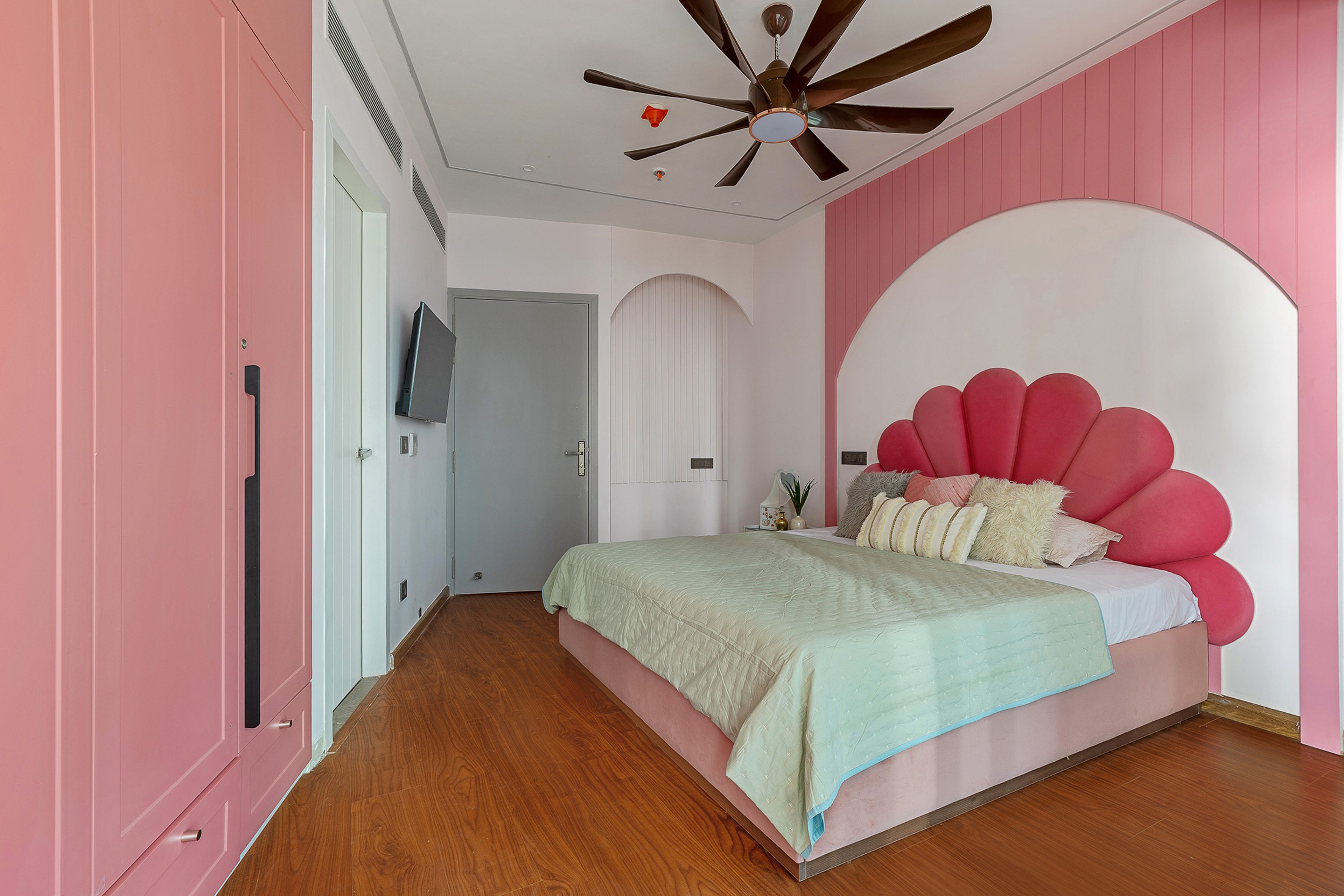 Bedroom Design with Pink Petal Shaped Headboard Bed and Pink 4-Door Swing Wardrobe