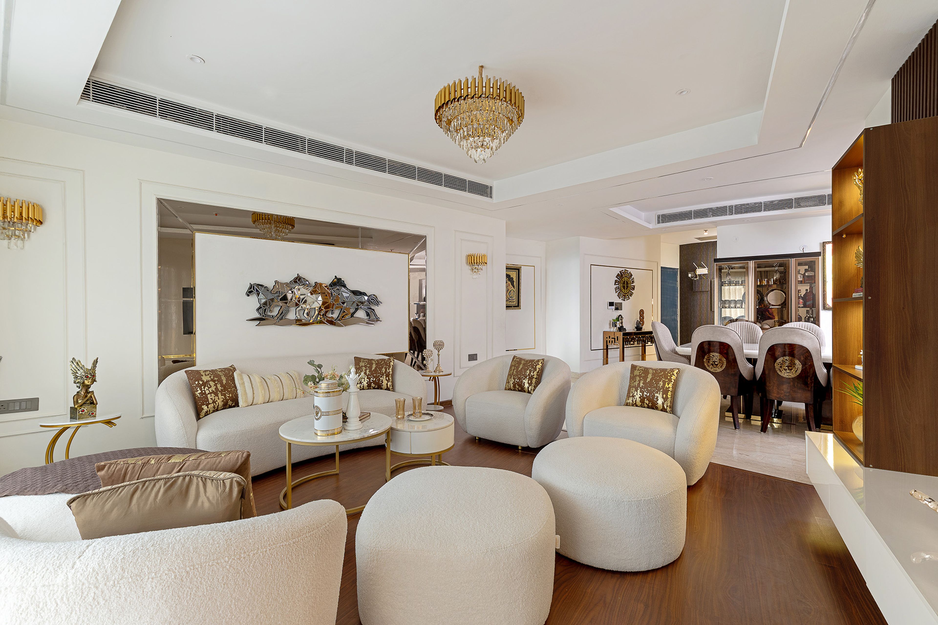 Living Room Design with White Sofas, 2 Ottomans and Metal Horse Artwork