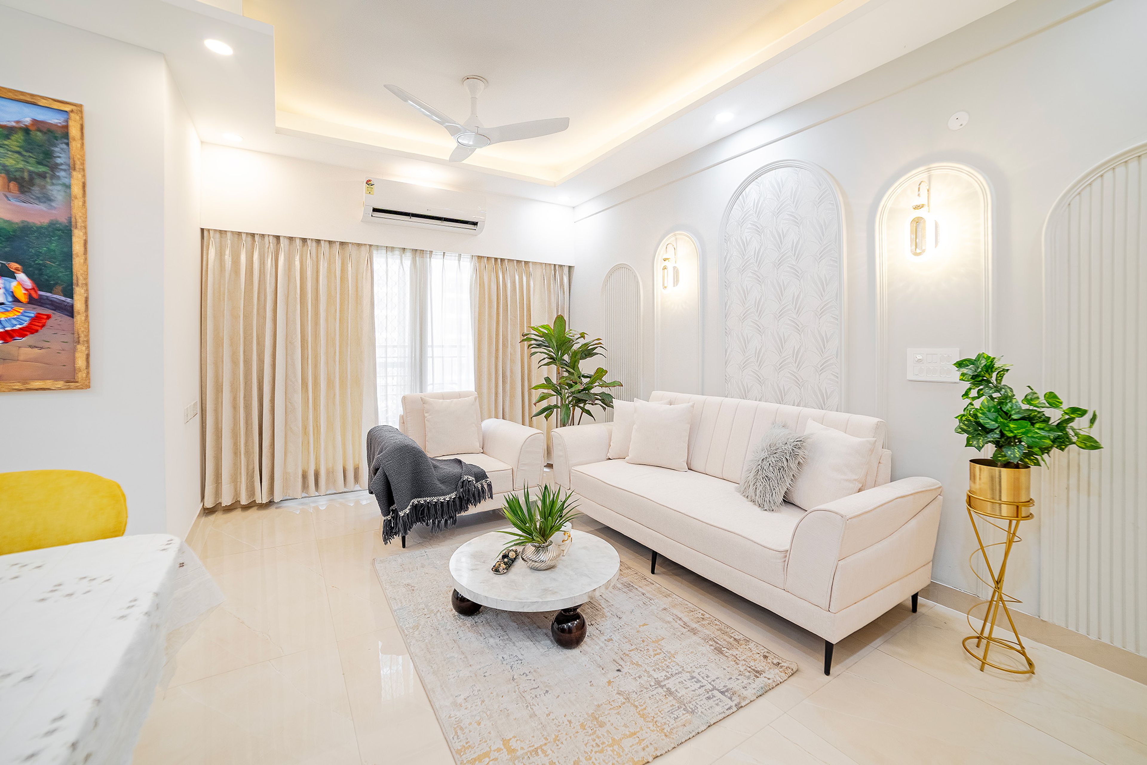 Living Room Design with Off-White Sofa and White Walls with Arched Trims